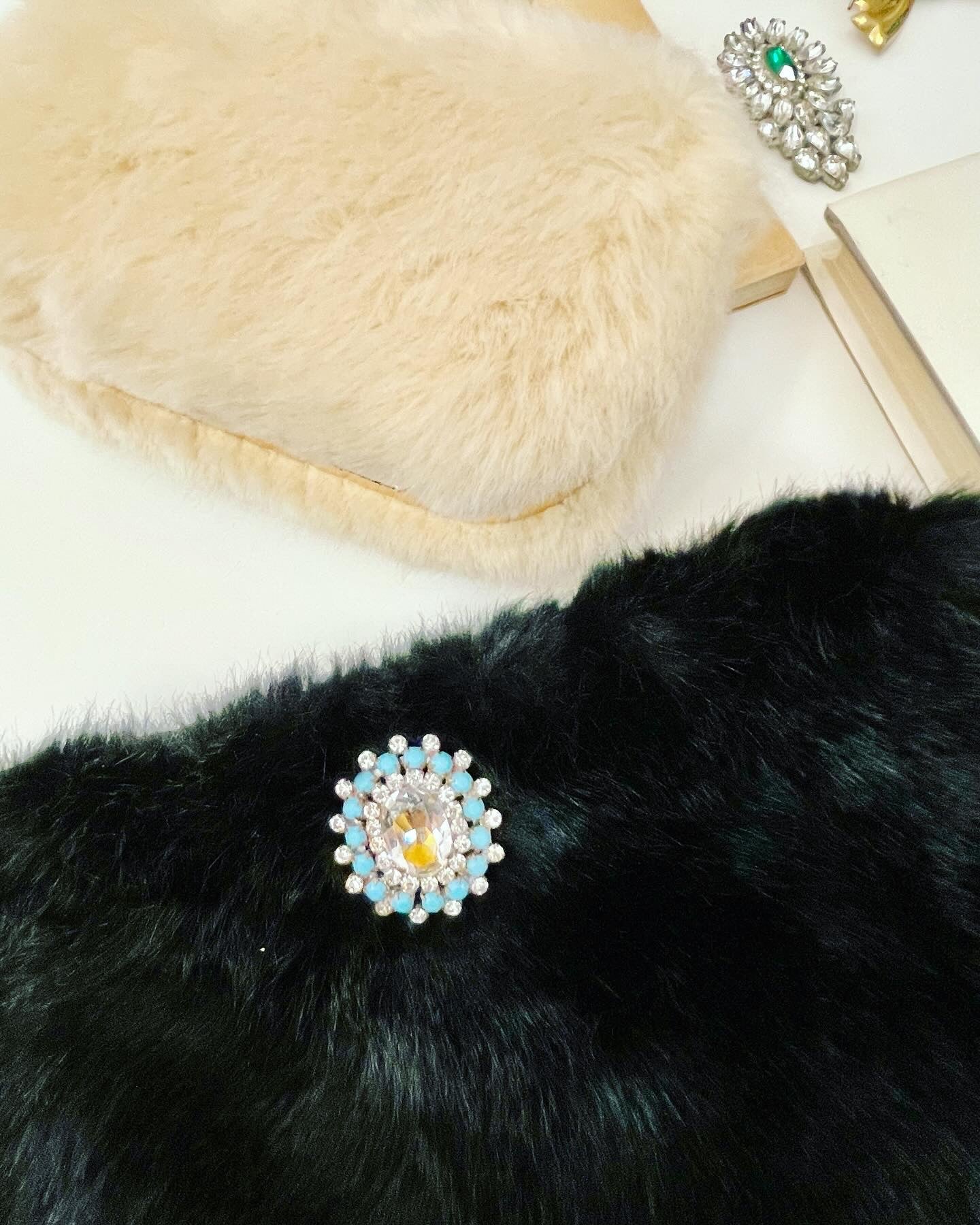 Ladies on Holiday, and her love of a classy evening bag! This noir faux fur clutch bag is so charming..