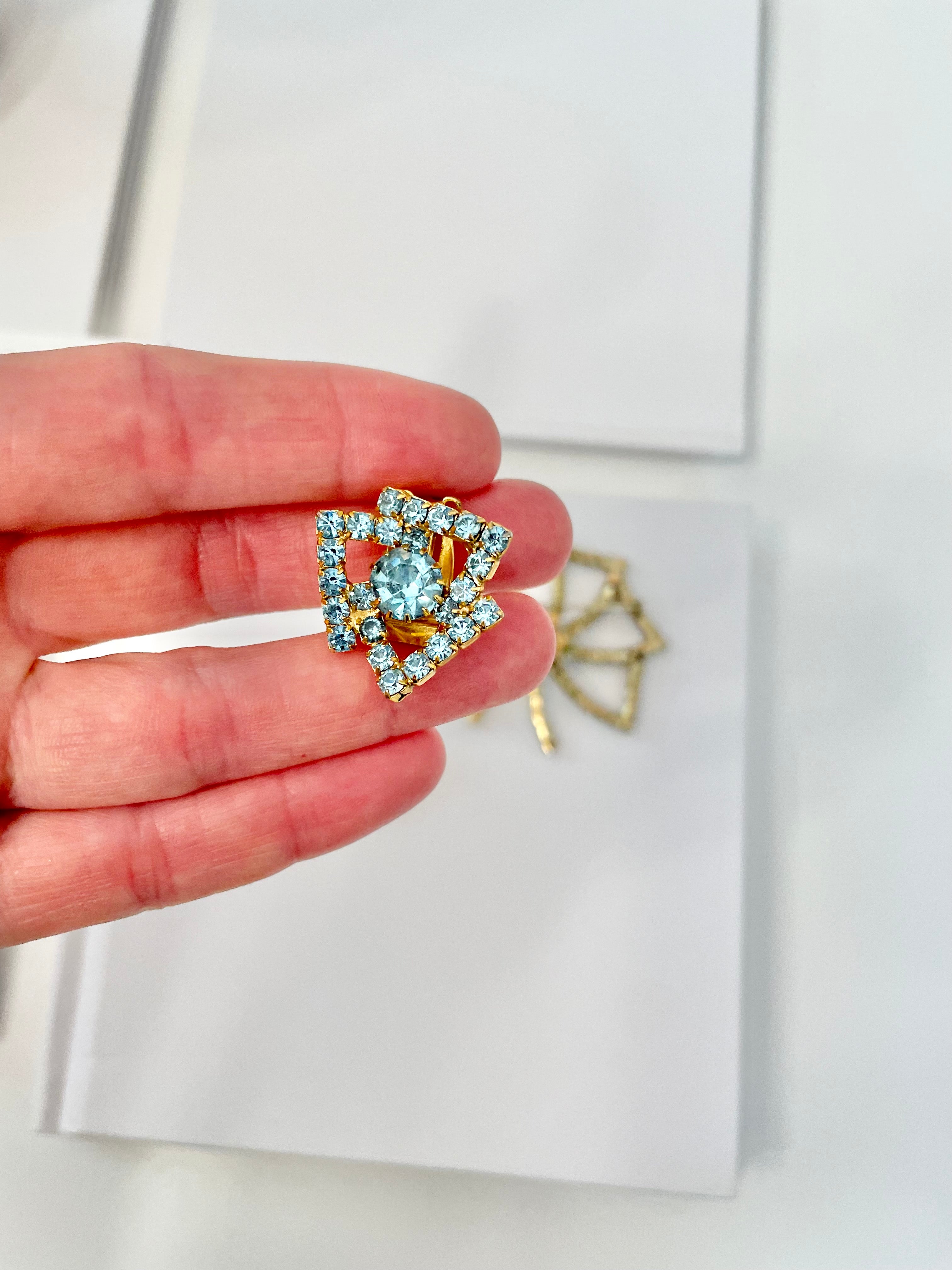 1960's Heiress and her love of a classy brooch set. This aqua glass brooch and earrings are truly divine.
