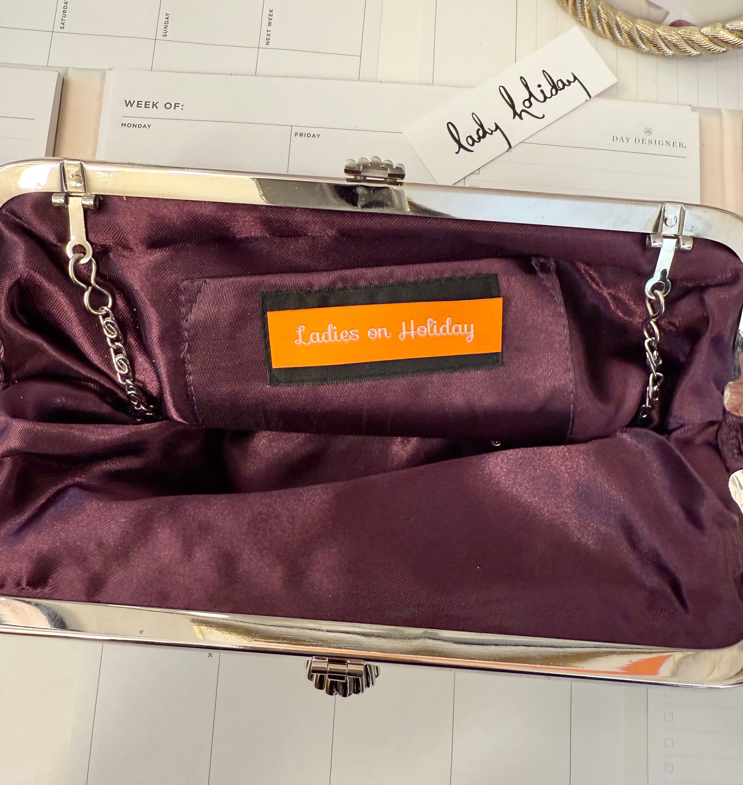 The most divine satin evening bag with extraordinary glass clasp...