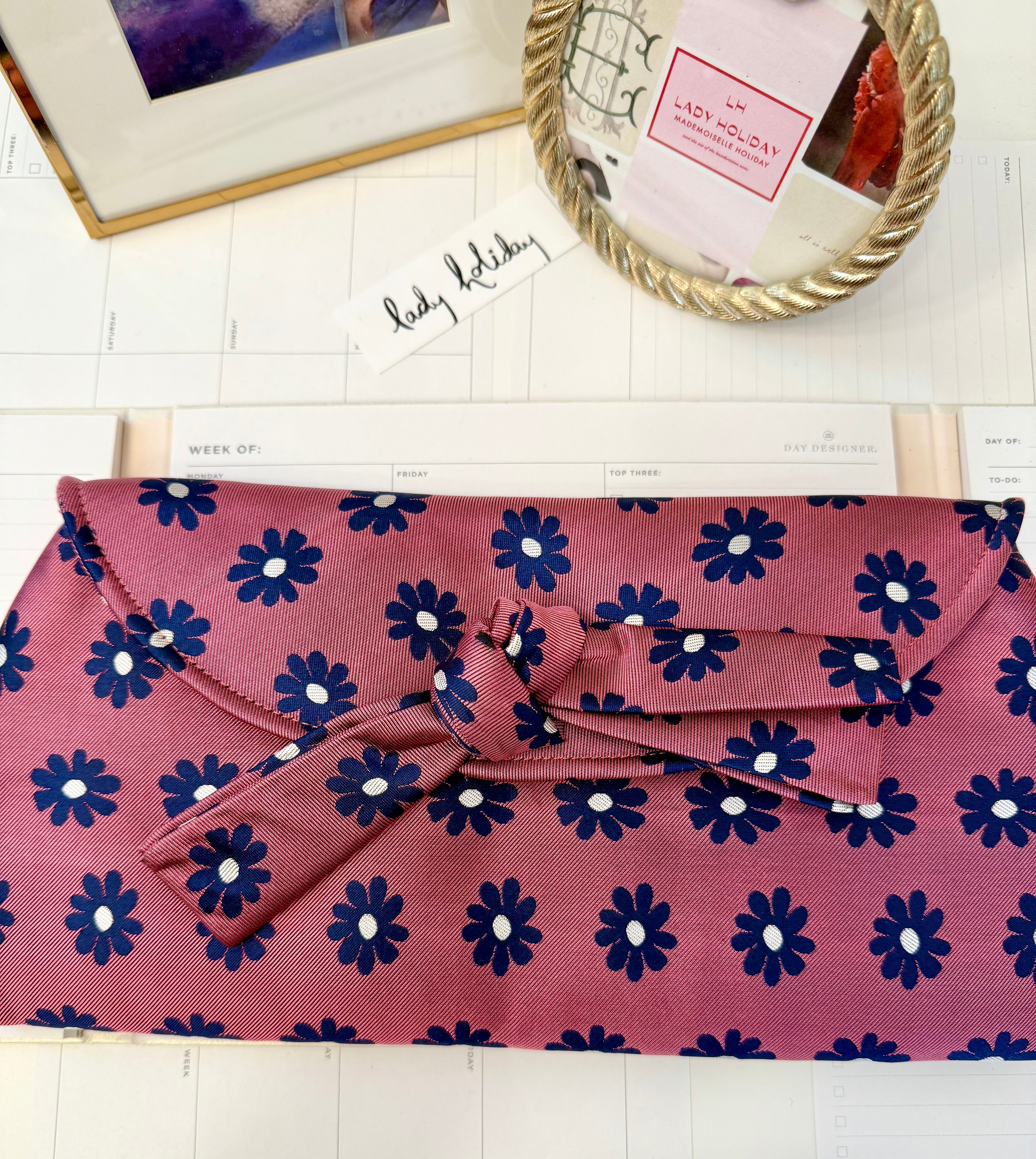 The most flirty and feminine floral bow clutch bag... so darling