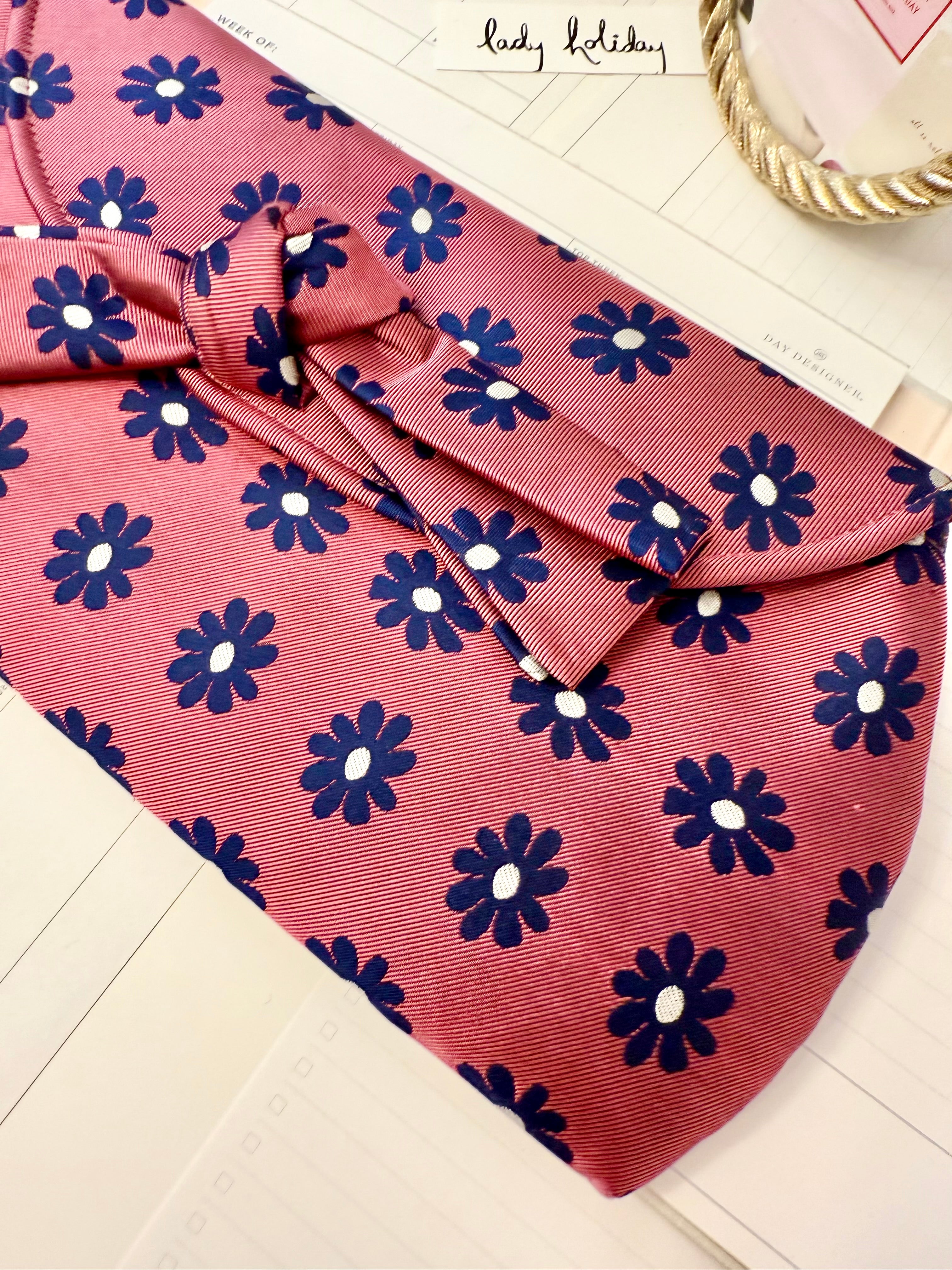 The most flirty and feminine floral bow clutch bag... so darling