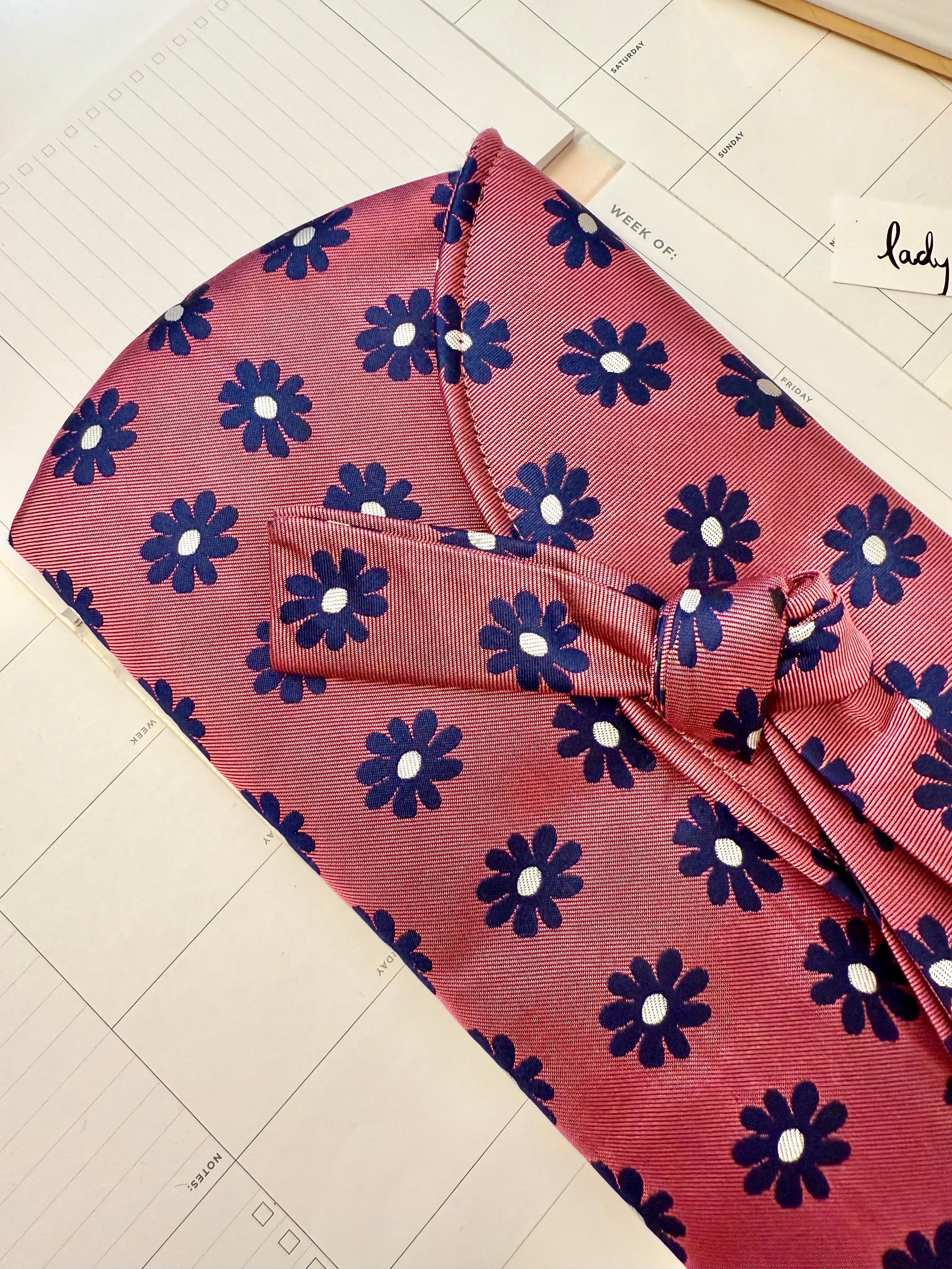 The most flirty and feminine floral bow clutch bag... so darling