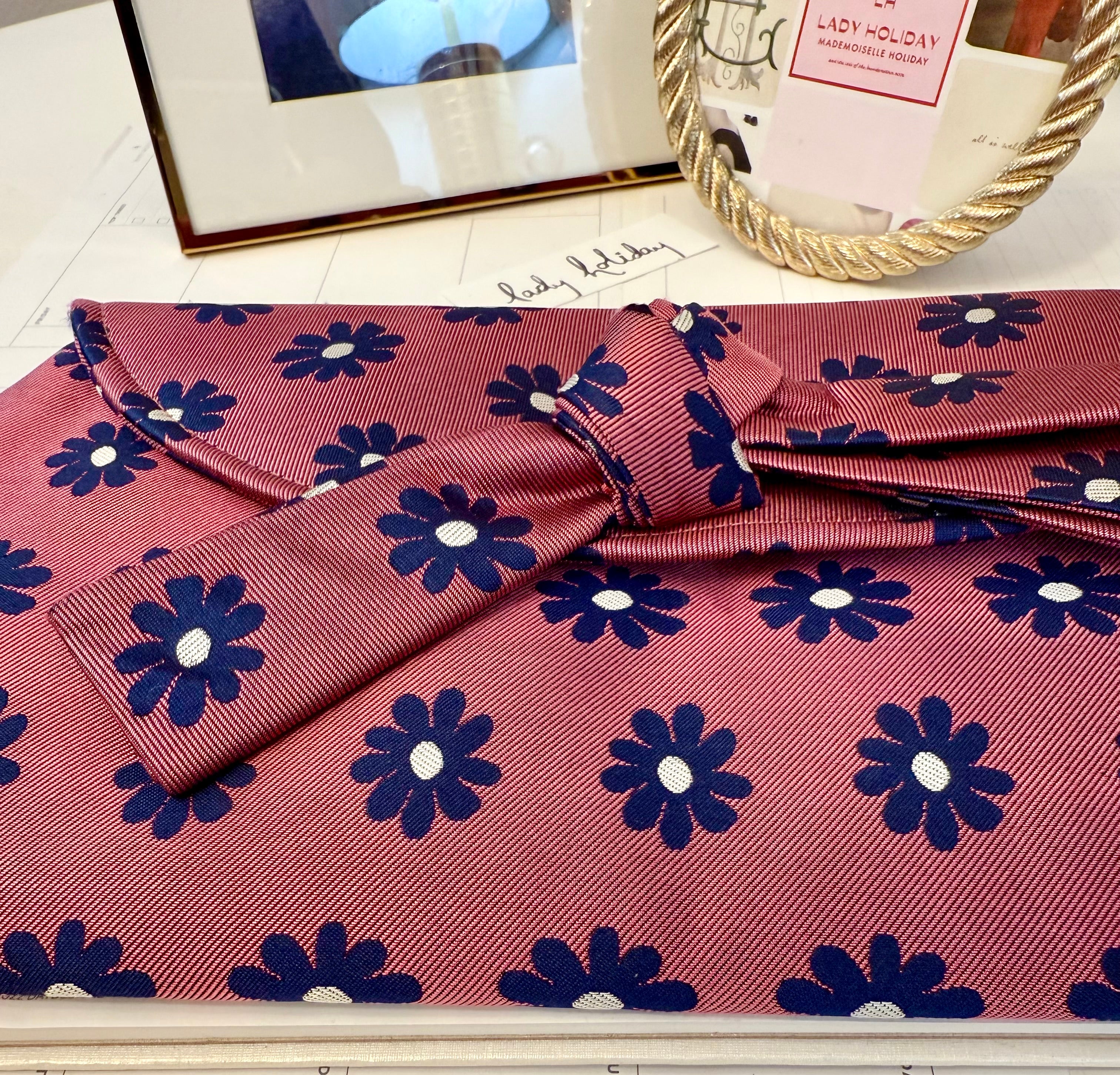 The most flirty and feminine floral bow clutch bag... so darling