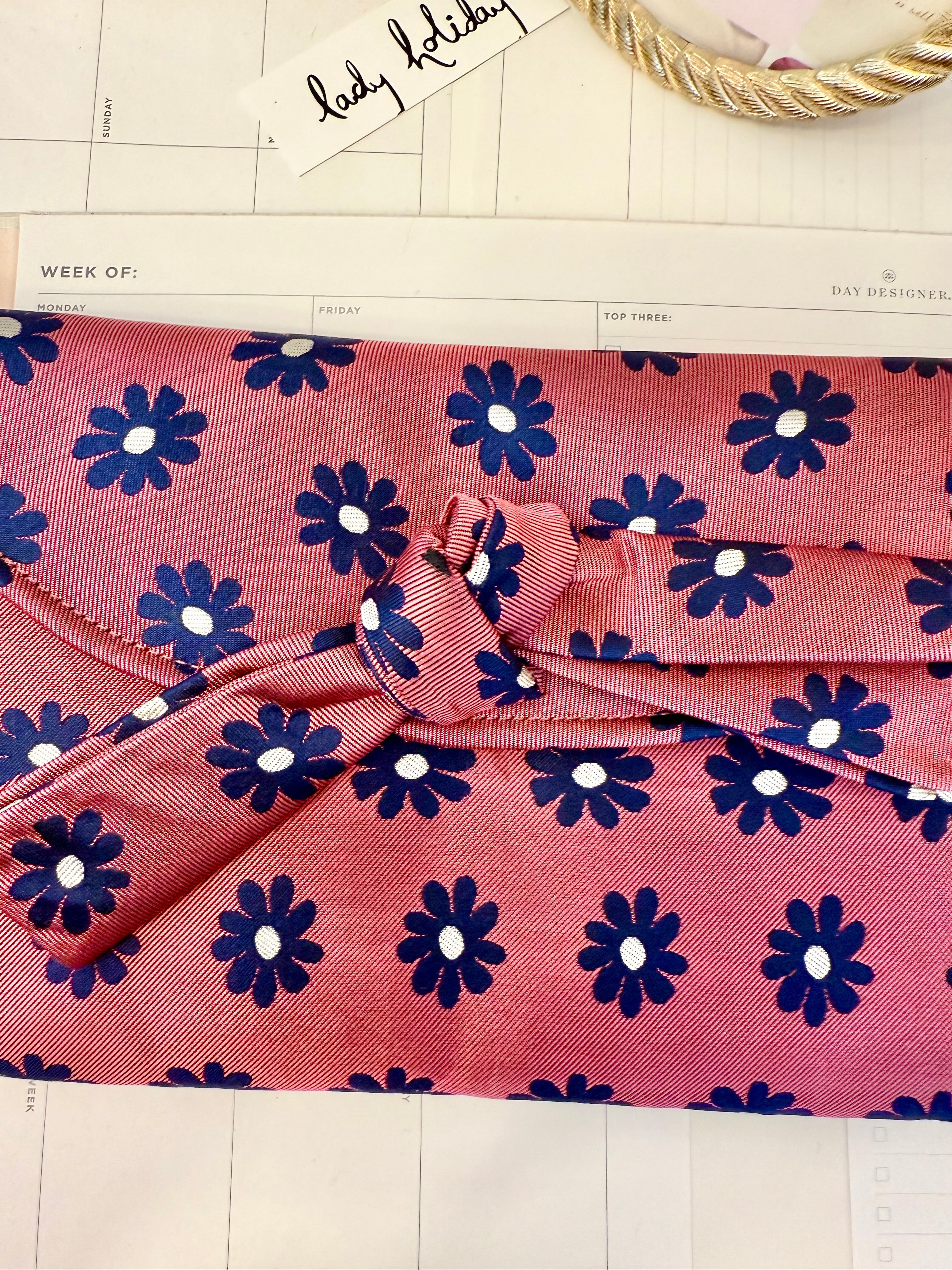 The most flirty and feminine floral bow clutch bag... so darling