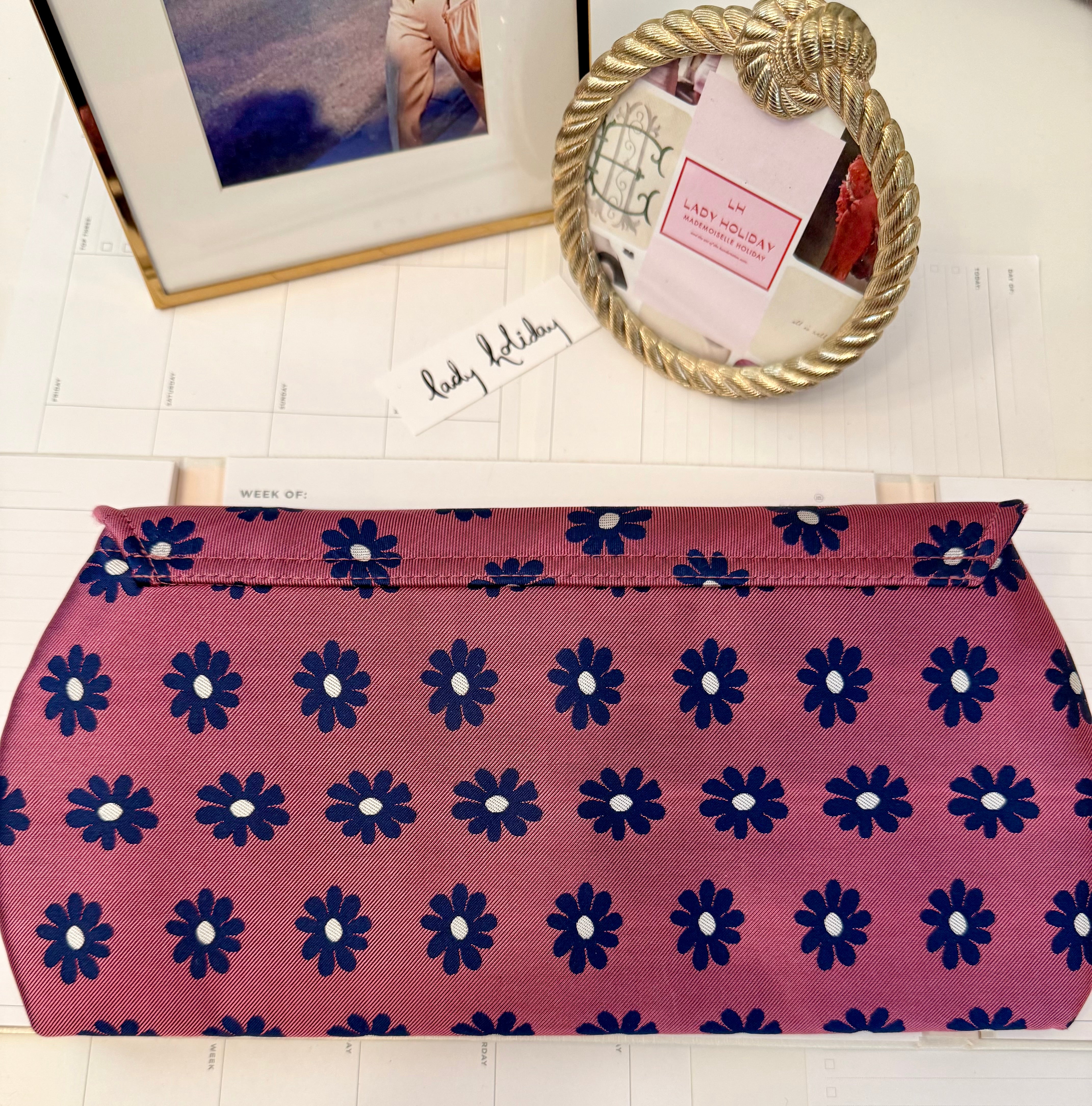 The most flirty and feminine floral bow clutch bag... so darling