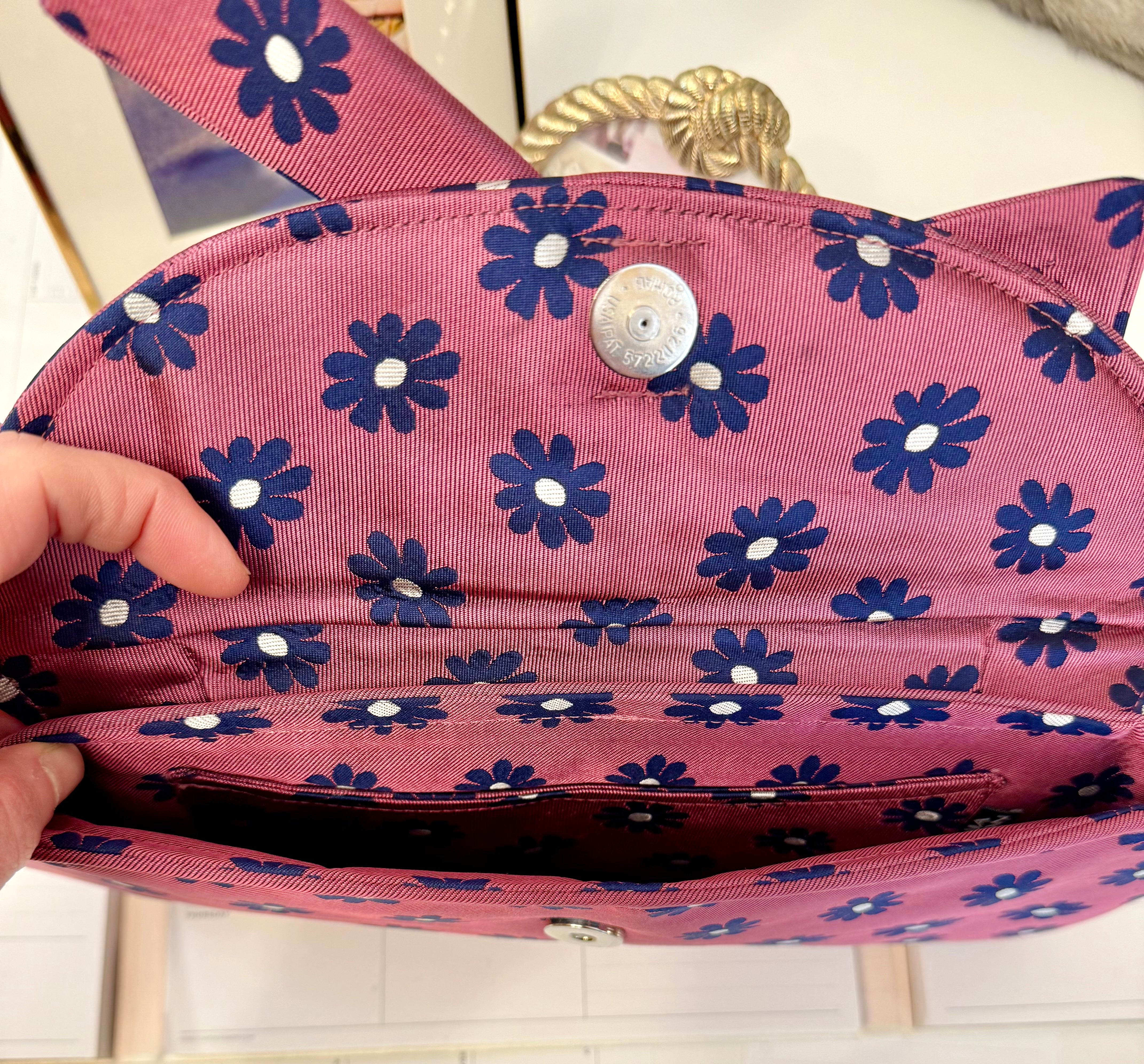The most flirty and feminine floral bow clutch bag... so darling