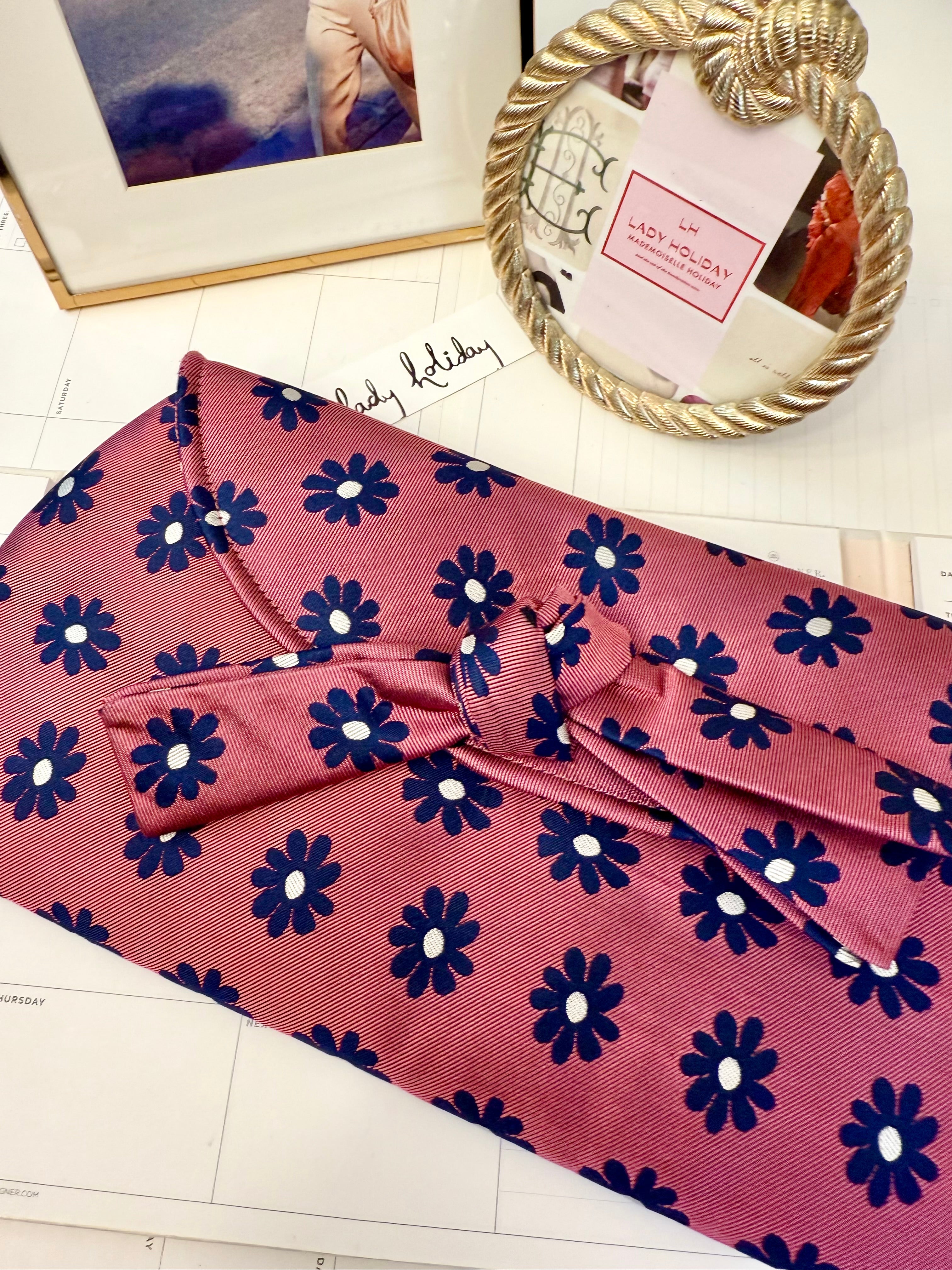 The most flirty and feminine floral bow clutch bag... so darling