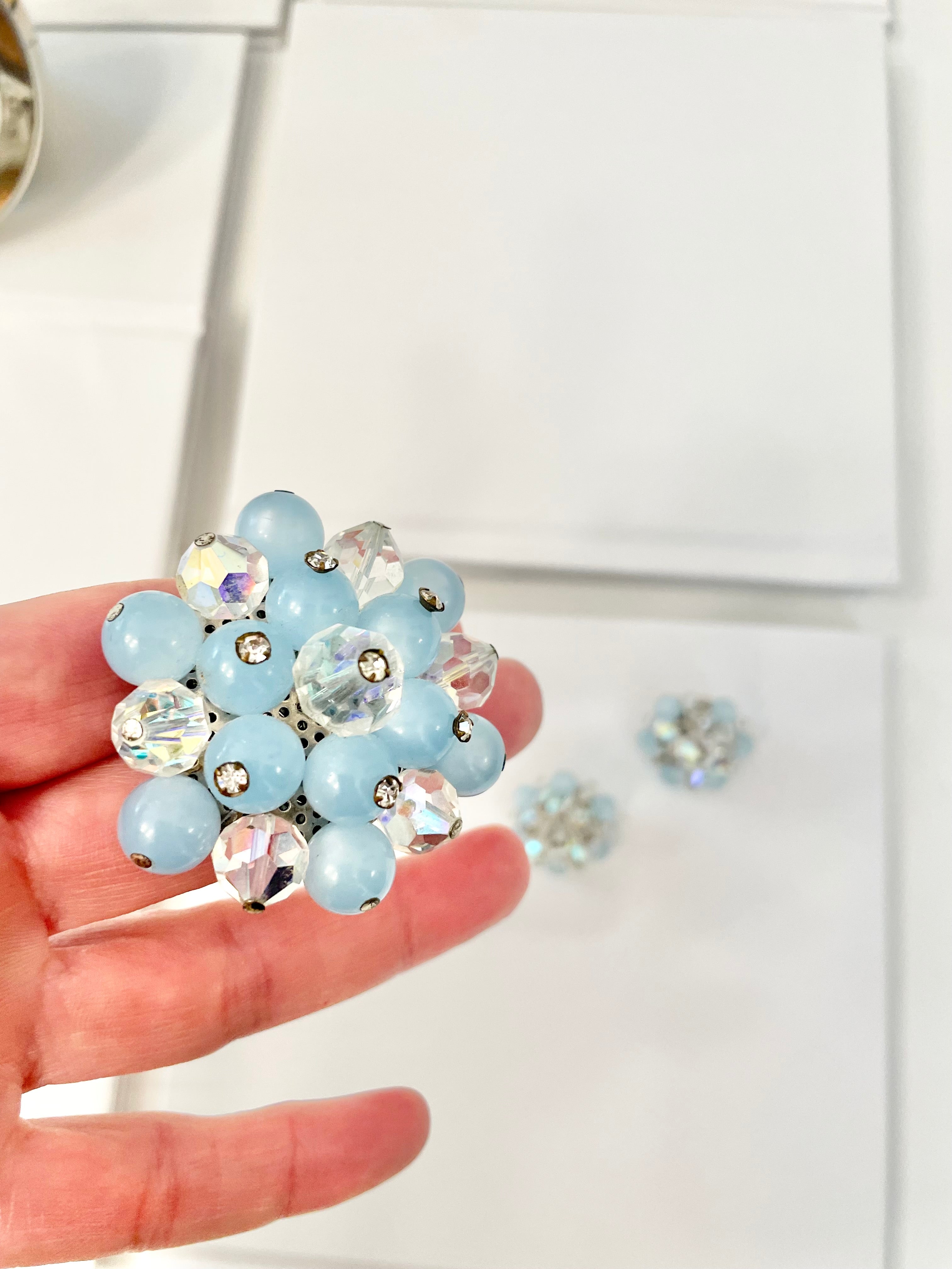 1960's Heiress and her love of the classic brooch, and matching earrings. Oh my! The soft blue with Austrian crystals is truly divine.