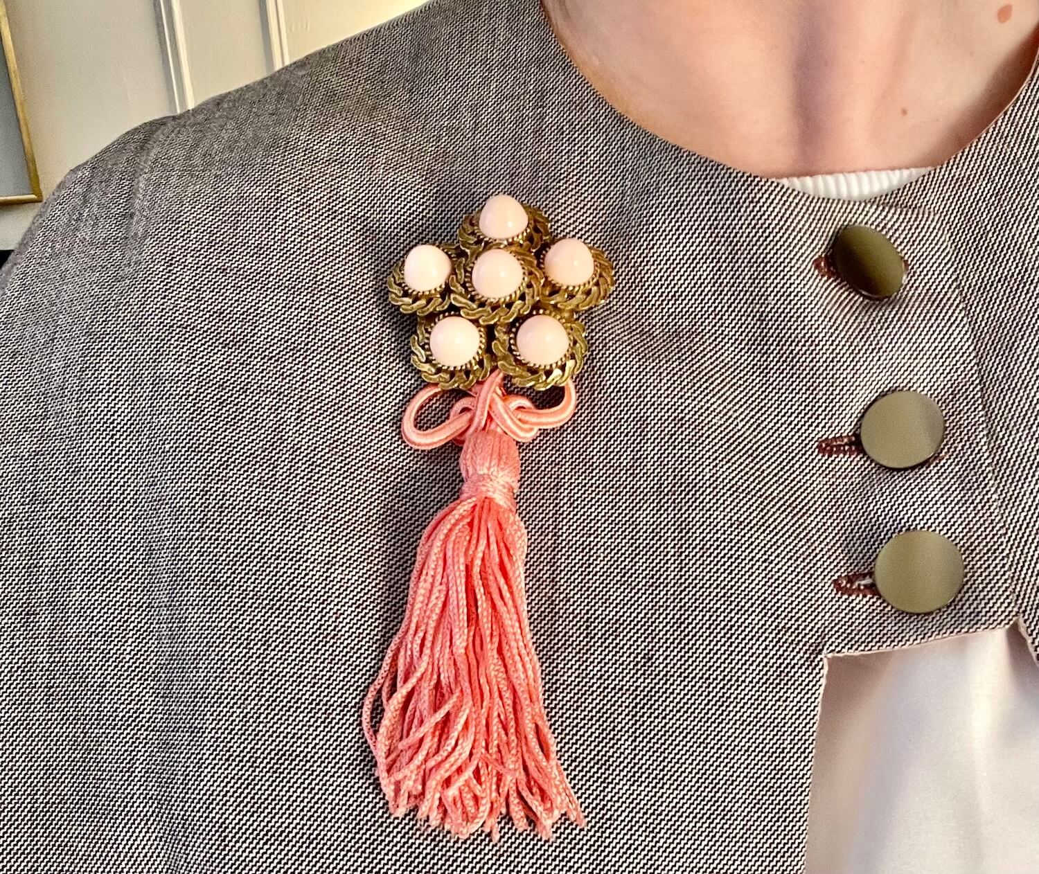 Vintage 1960’s faux angel skin coral brooch, with added tassel for a bit of fun flair!
