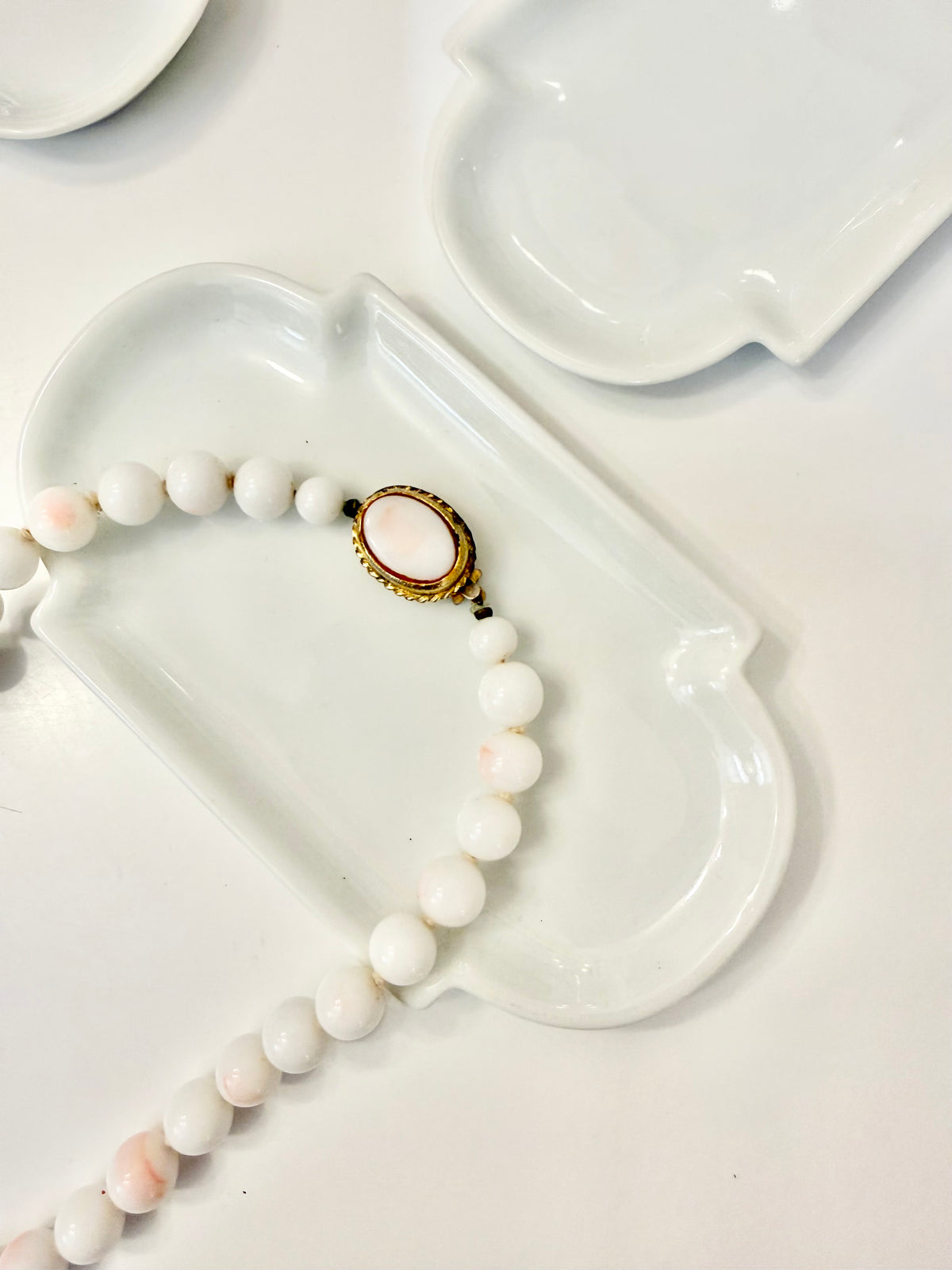 The most elegant faux angel skin coral glass necklace... so feminine