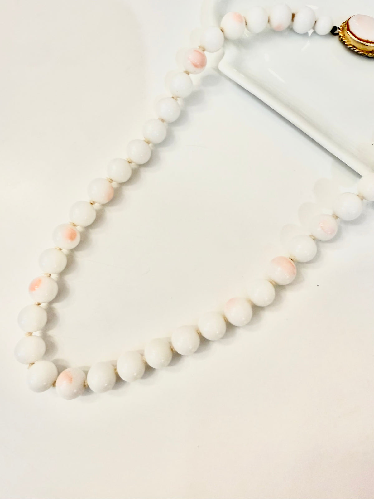 The most elegant faux angel skin coral glass necklace... so feminine