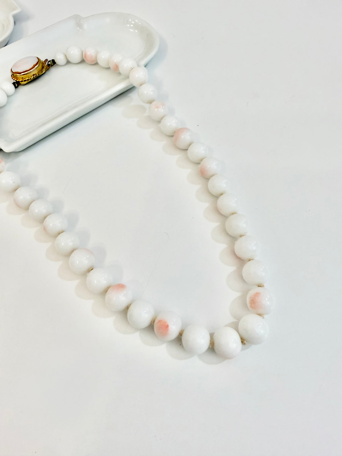 The most elegant faux angel skin coral glass necklace... so feminine