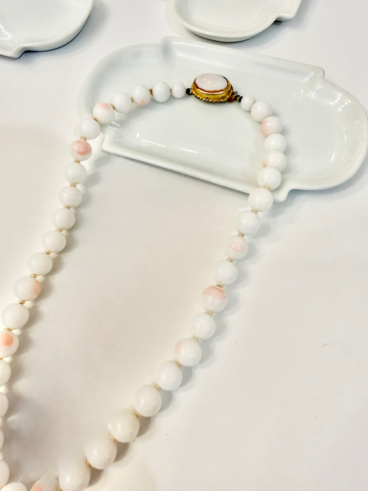 The most elegant faux angel skin coral glass necklace... so feminine