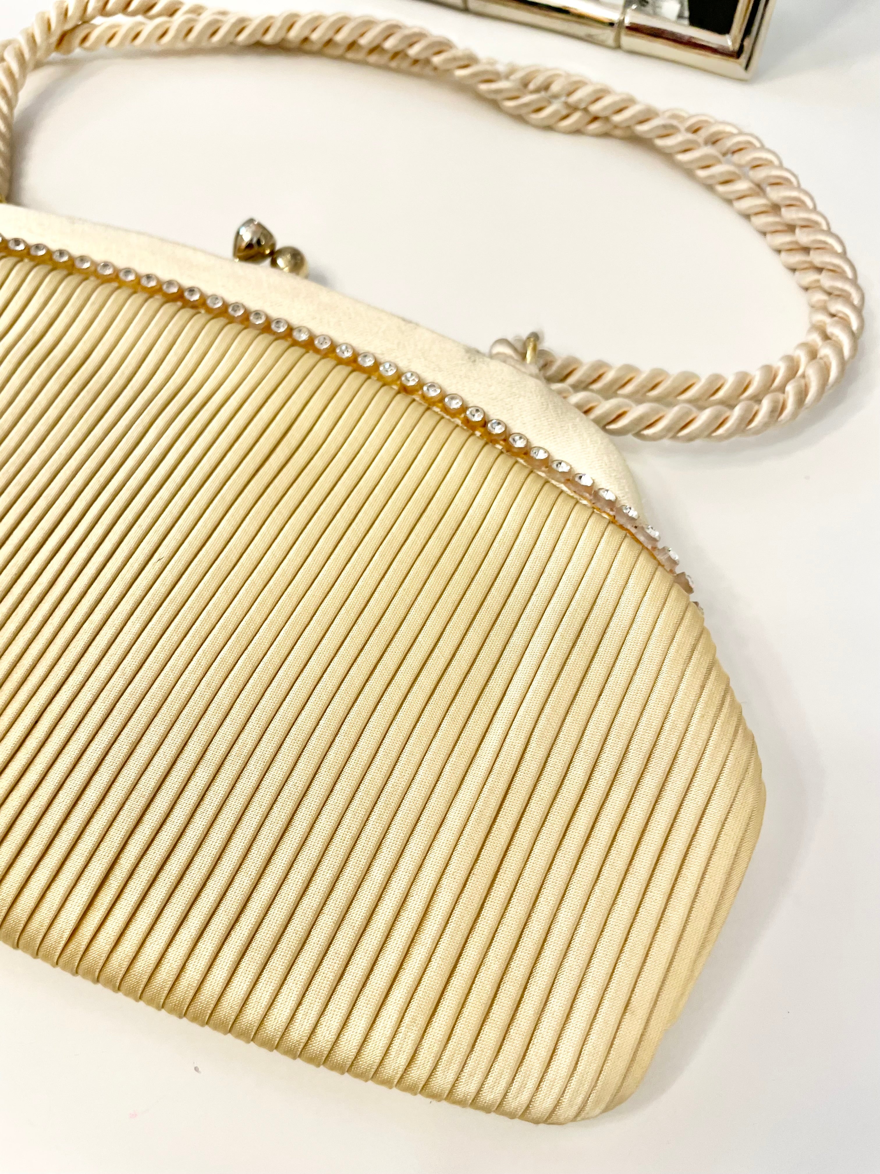 The most lovely ivory satin pleated evening bag.... so chic