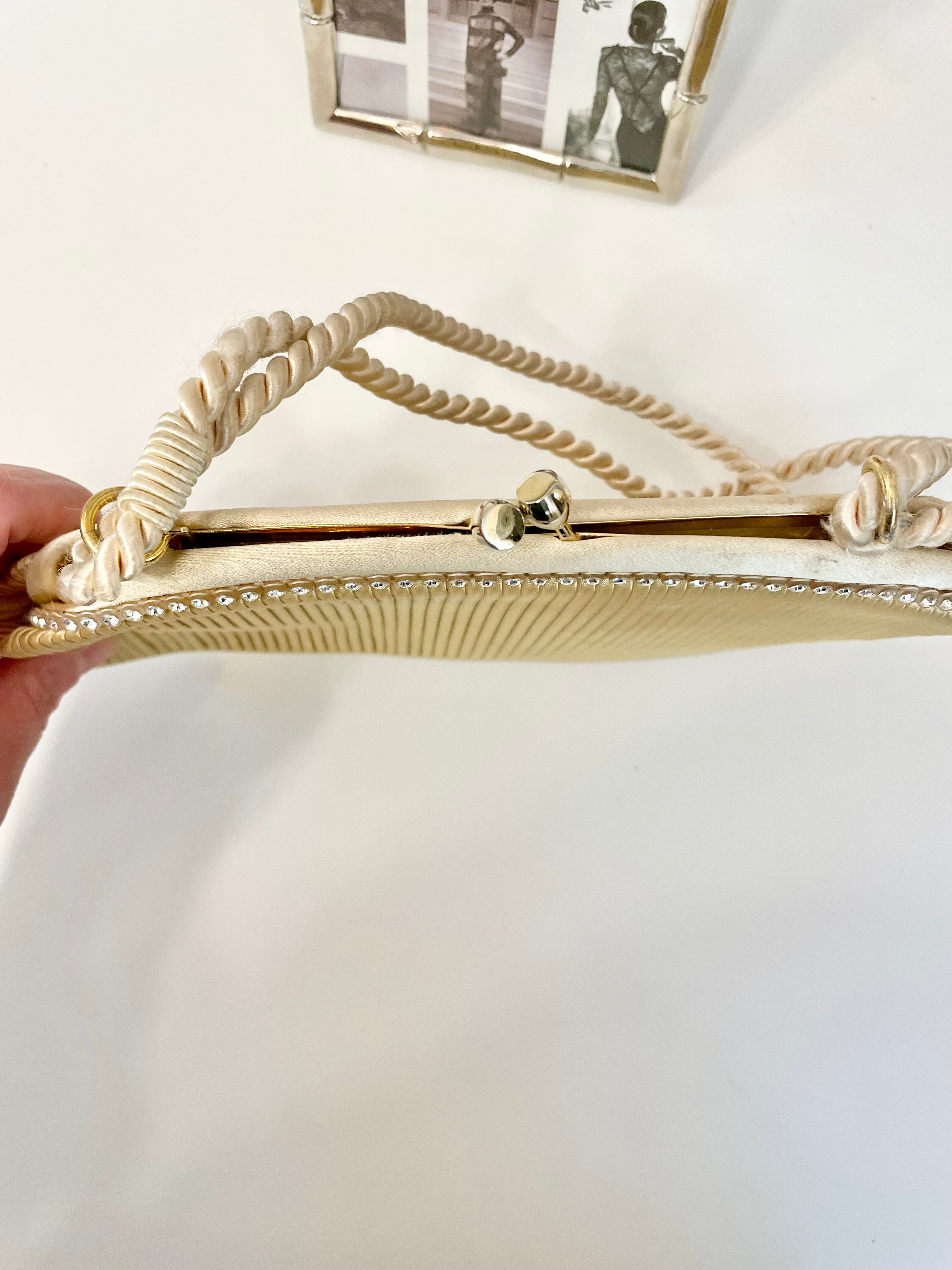 The most lovely ivory satin pleated evening bag.... so chic