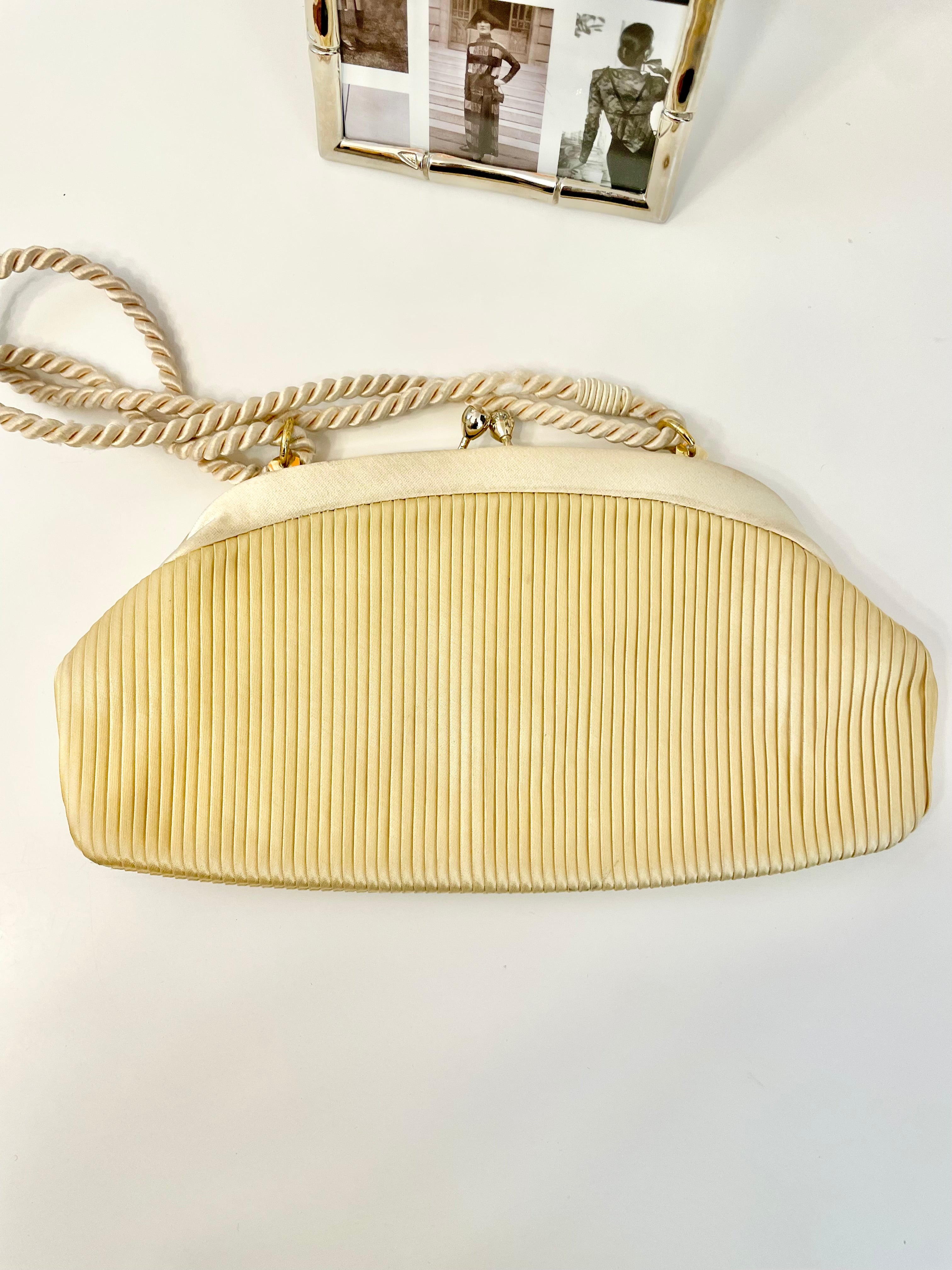 The most lovely ivory satin pleated evening bag.... so chic