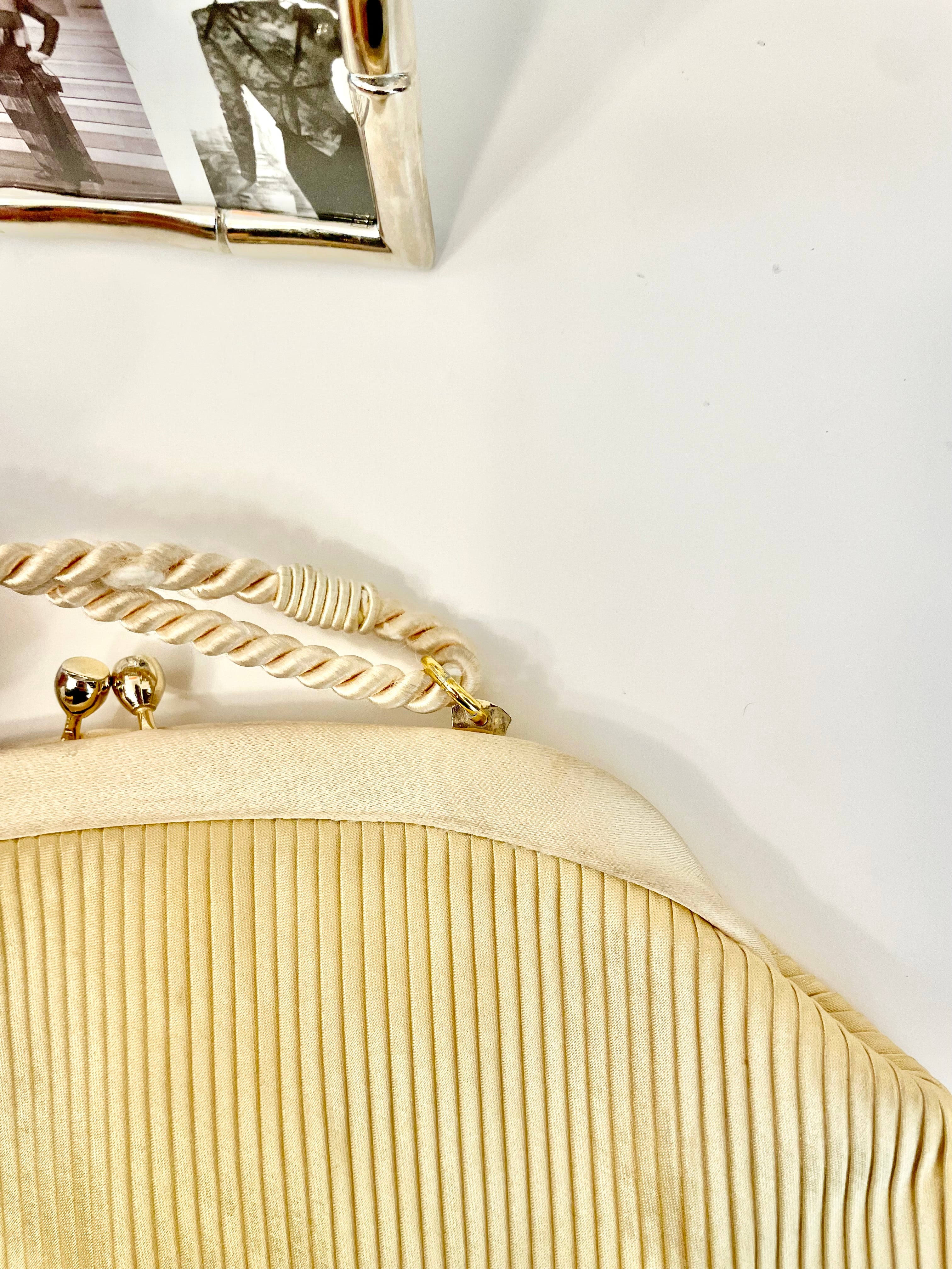The most lovely ivory satin pleated evening bag.... so chic
