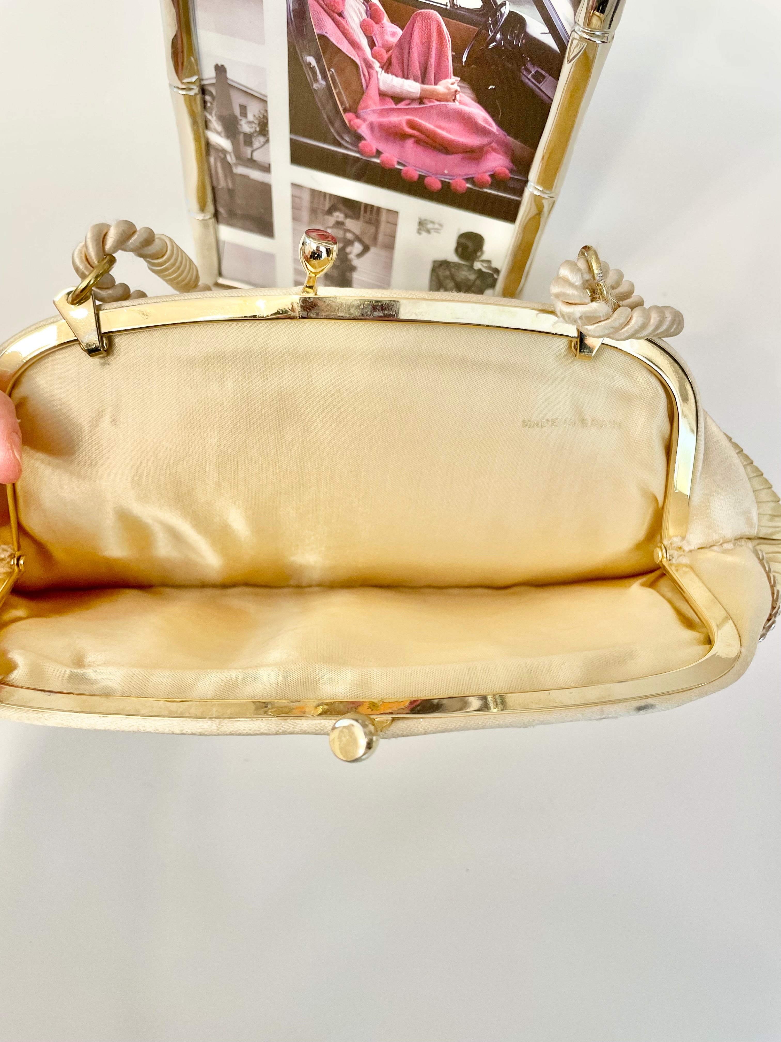 The most lovely ivory satin pleated evening bag.... so chic