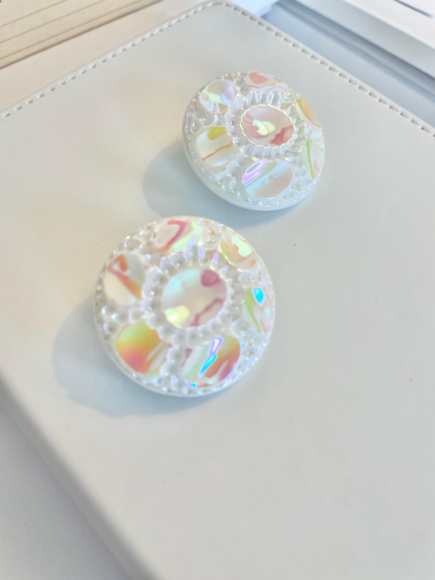 Vintage 1970's shimmery white button clip earrings.