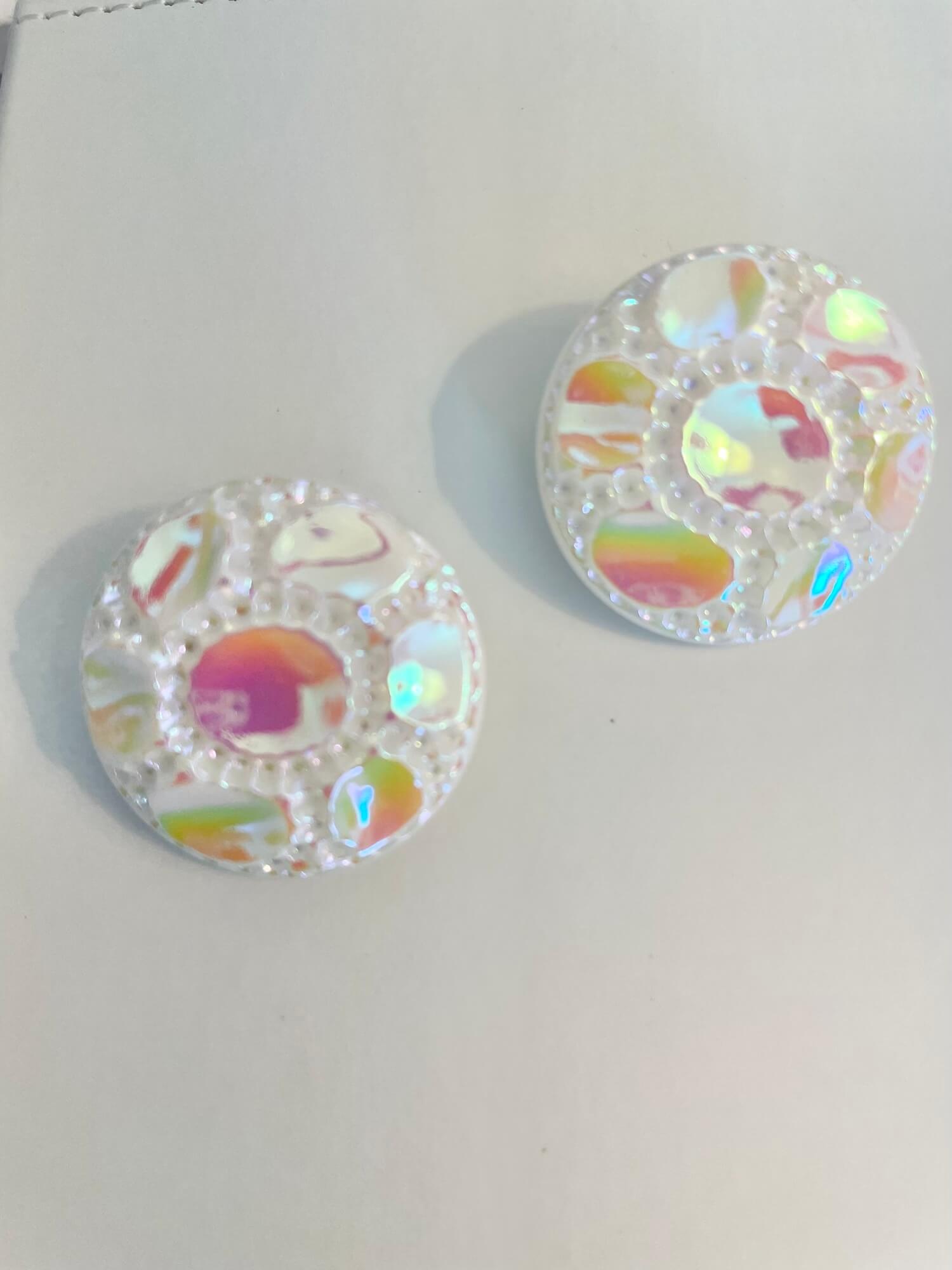 Vintage 1970's shimmery white button clip earrings.