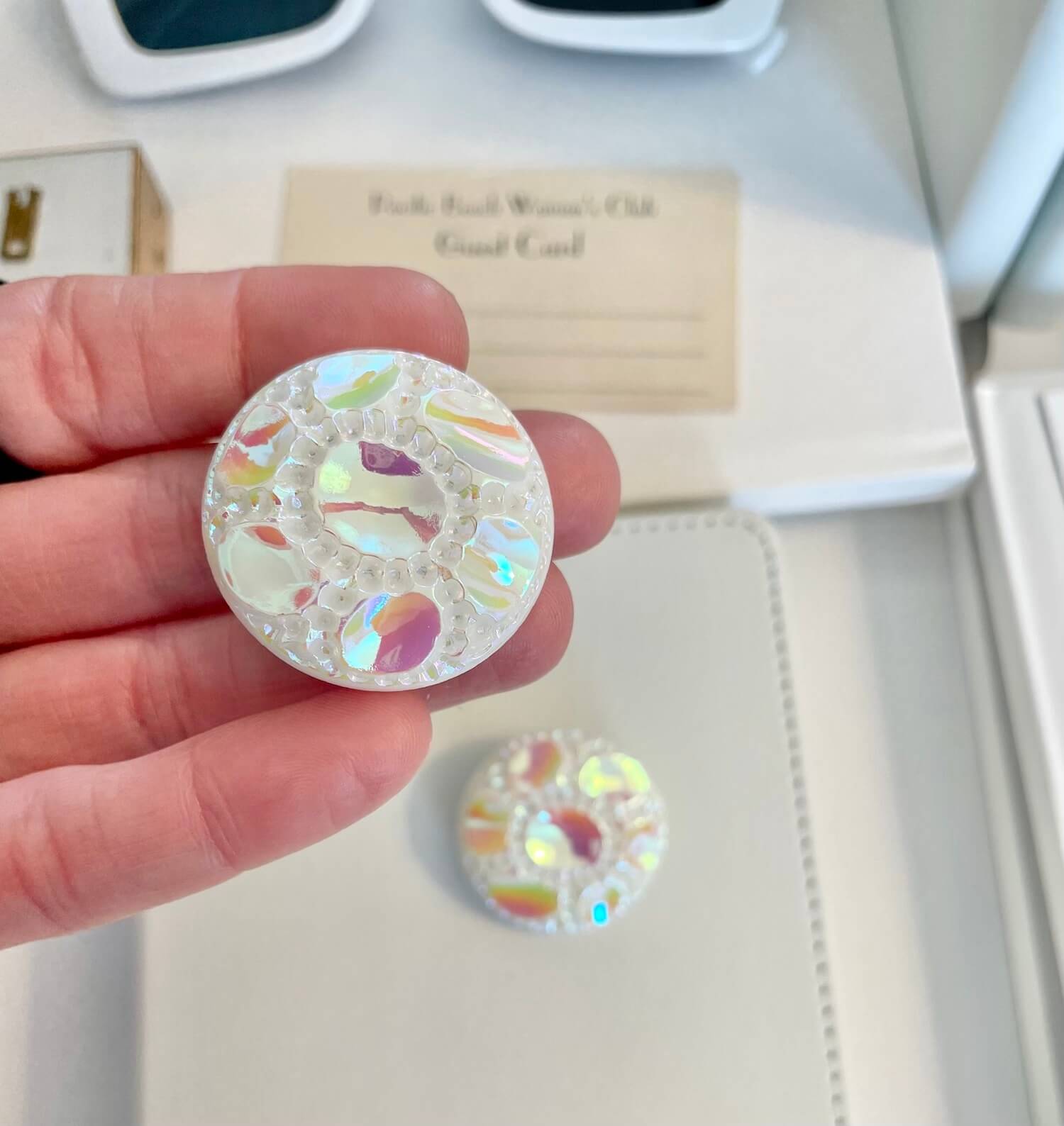 Vintage 1970's shimmery white button clip earrings.