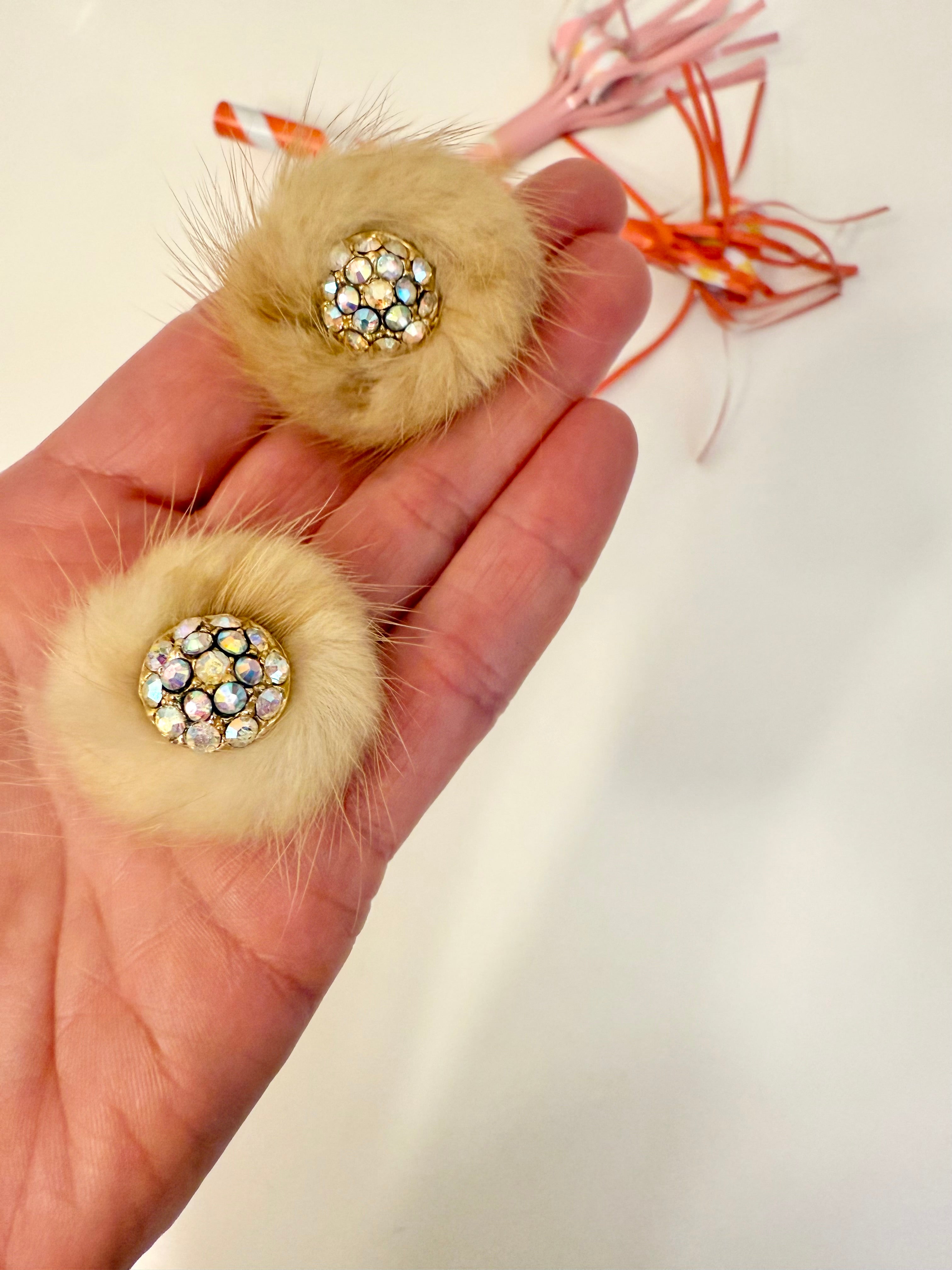 The mink button earring....