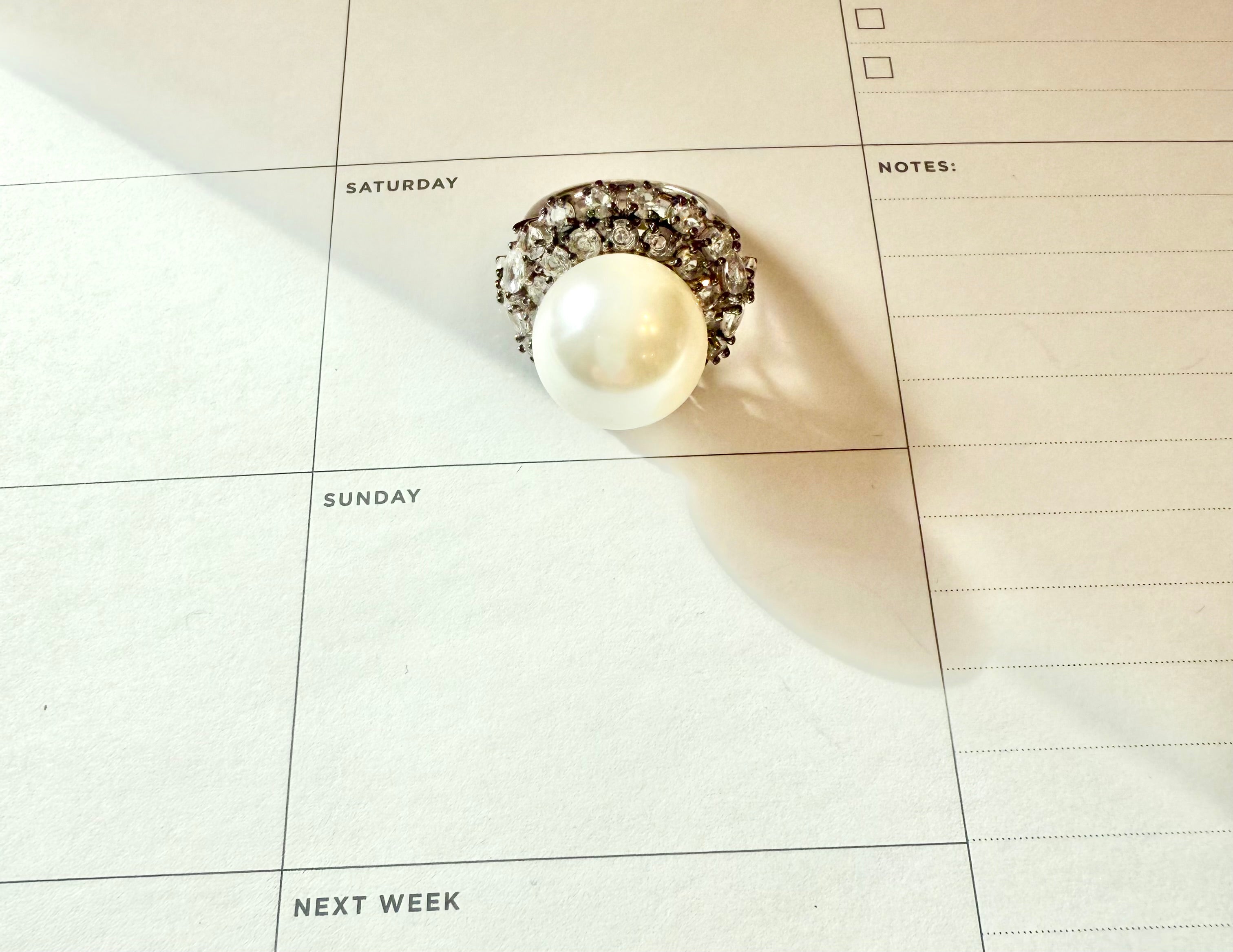 The most divine faux pearl, and white topaz cocktail ring.... elegance