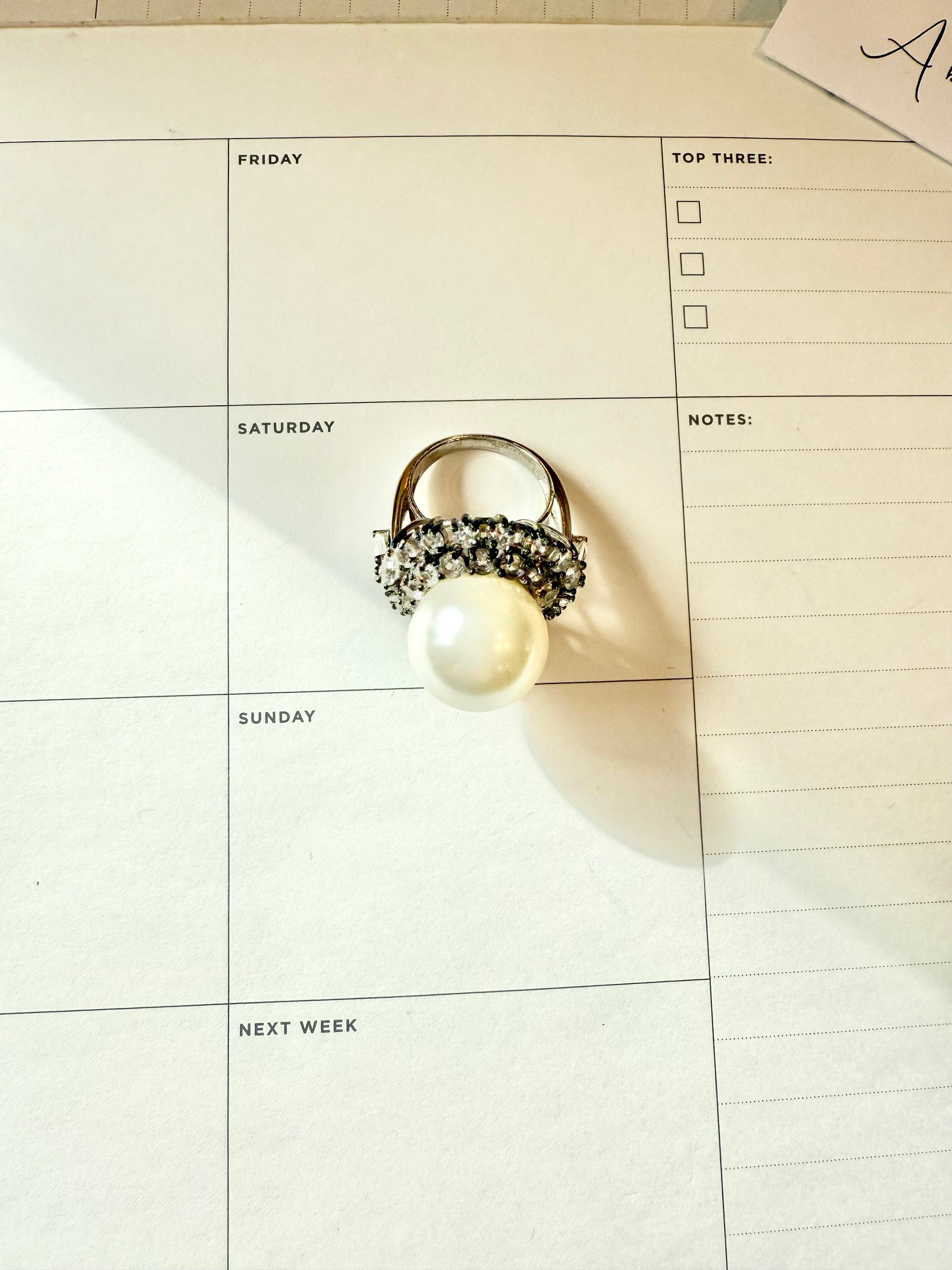 The most divine faux pearl, and white topaz cocktail ring.... elegance