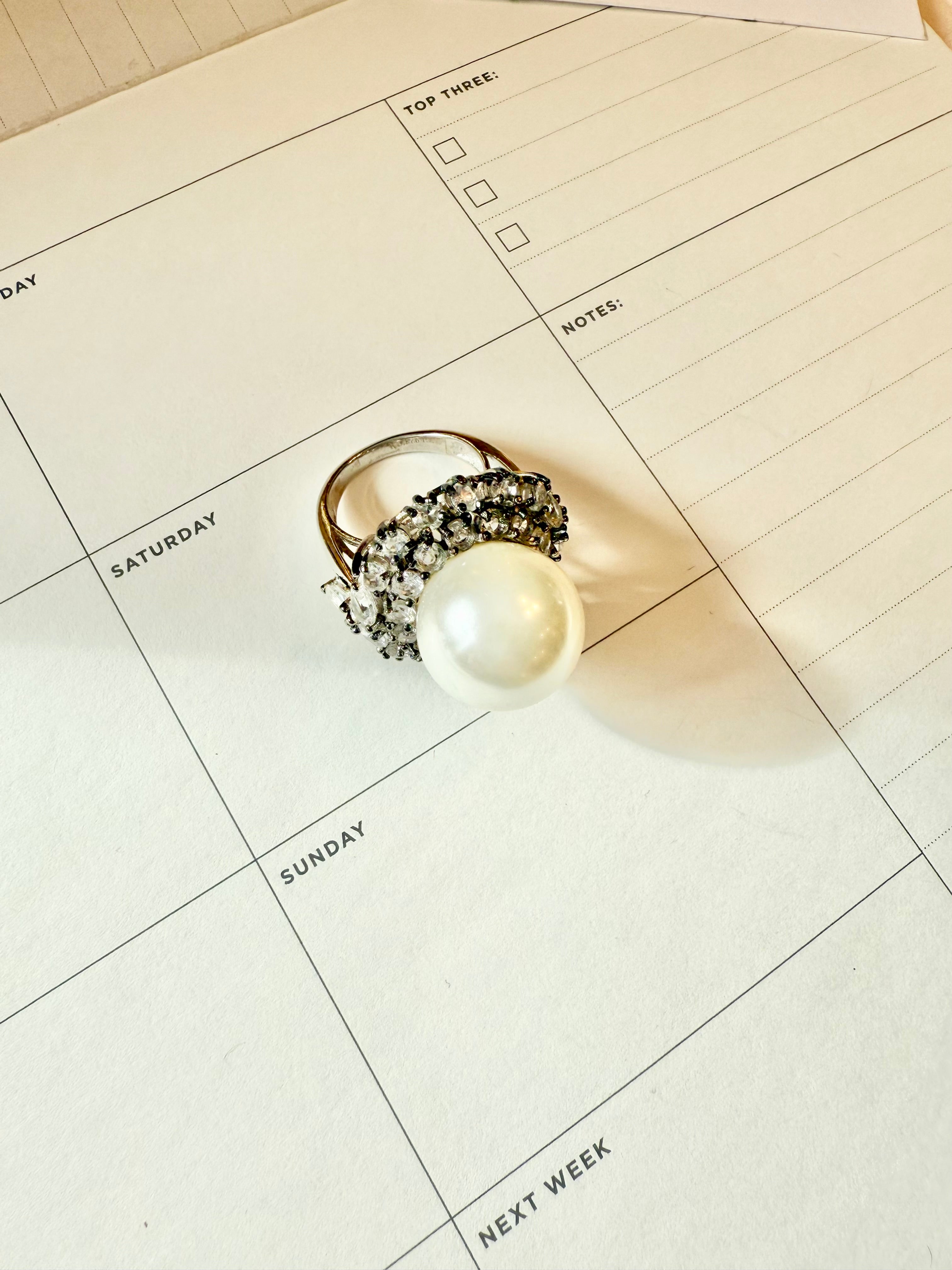 The most divine faux pearl, and white topaz cocktail ring.... elegance
