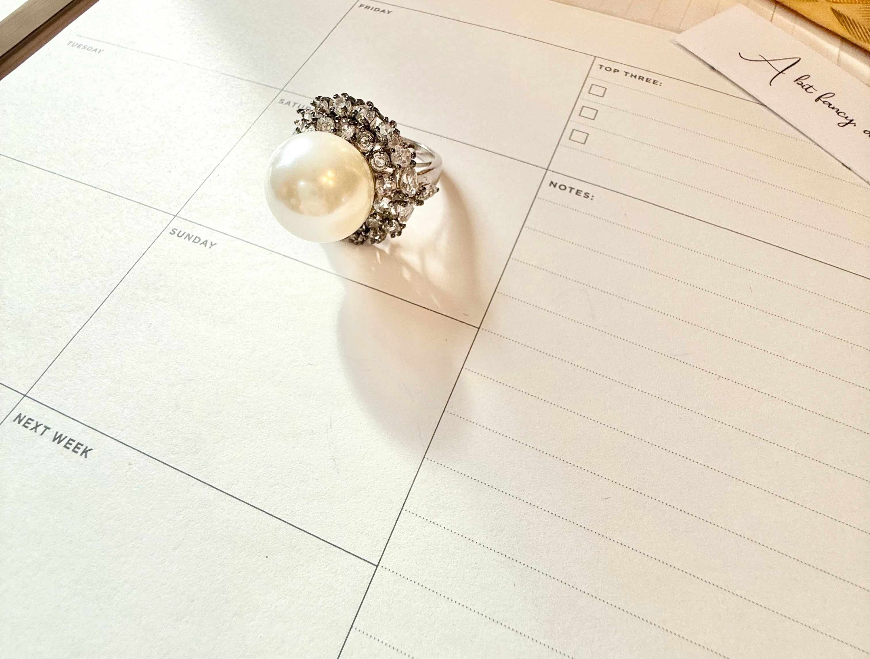 The most divine faux pearl, and white topaz cocktail ring.... elegance