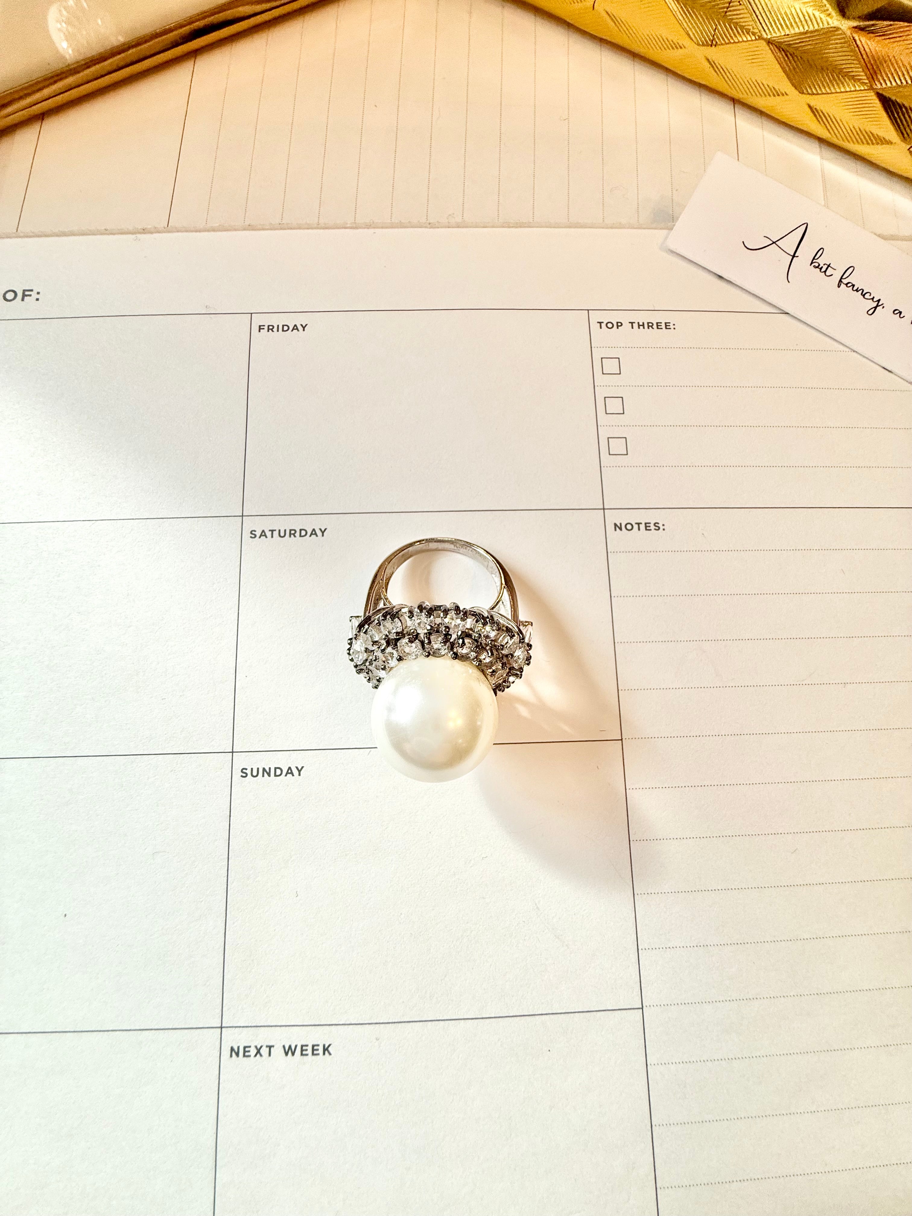 The most divine faux pearl, and white topaz cocktail ring.... elegance