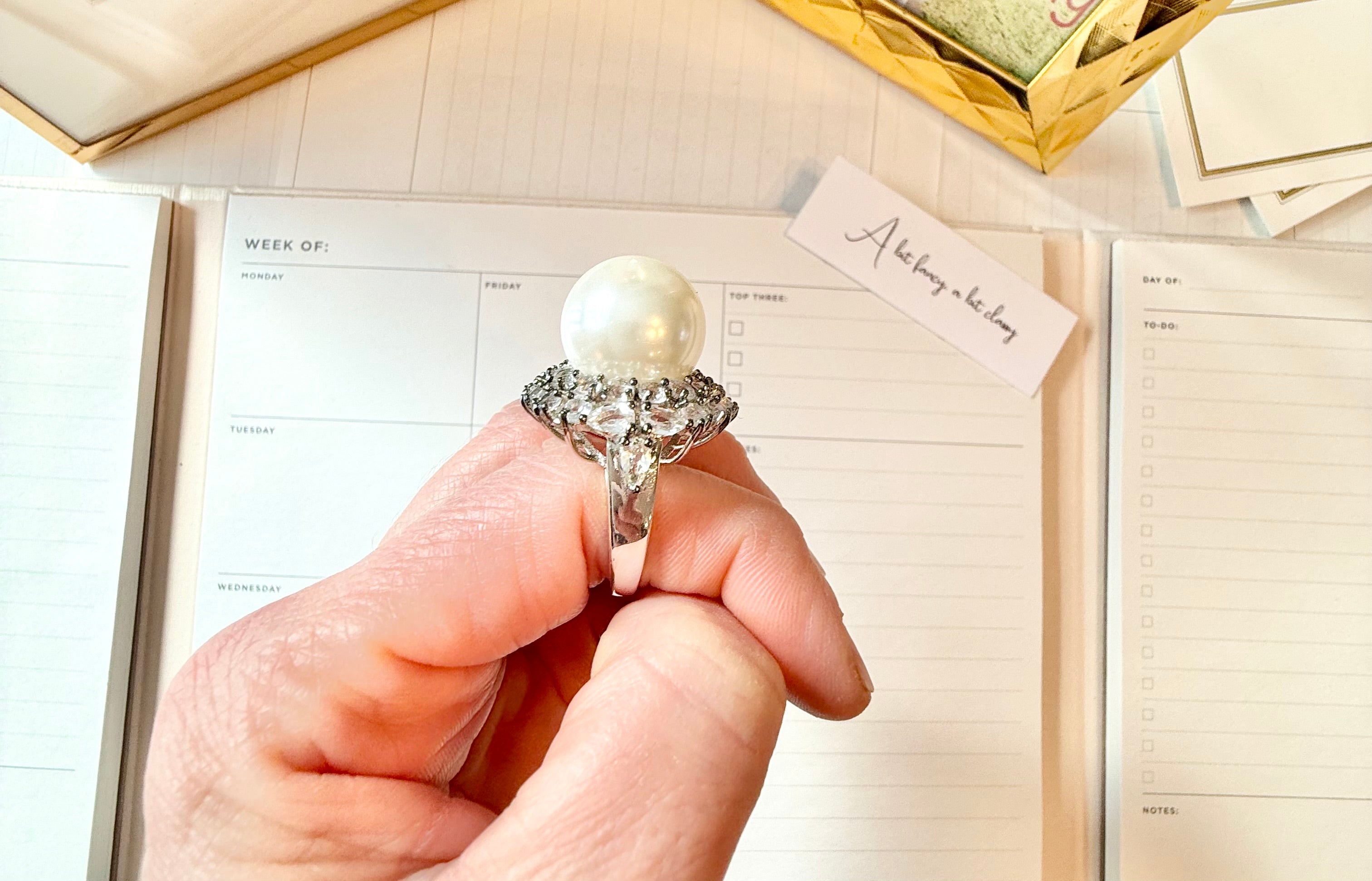 The most divine faux pearl, and white topaz cocktail ring.... elegance