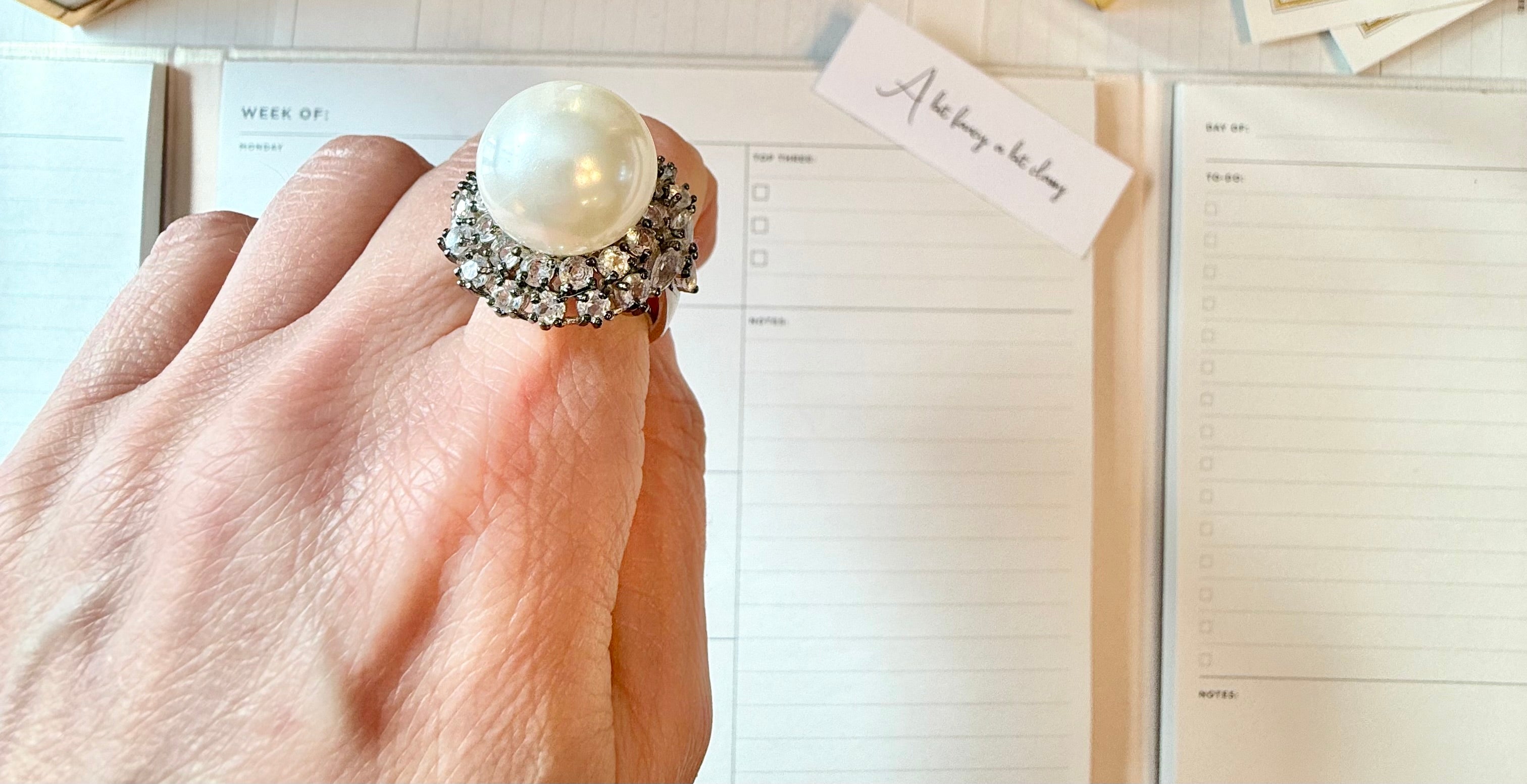 The most divine faux pearl, and white topaz cocktail ring.... elegance