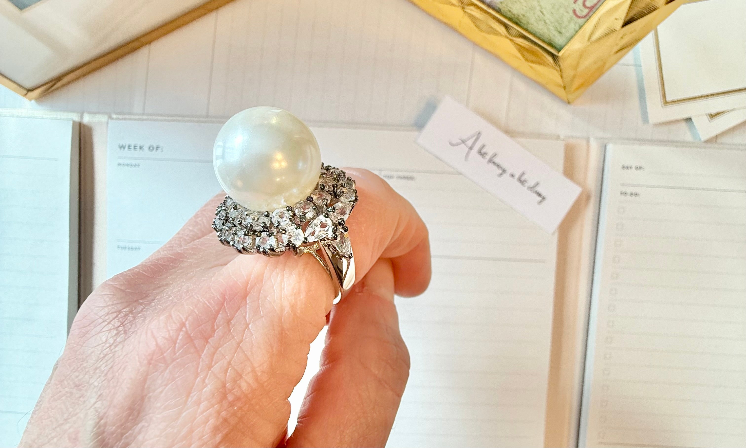 The most divine faux pearl, and white topaz cocktail ring.... elegance