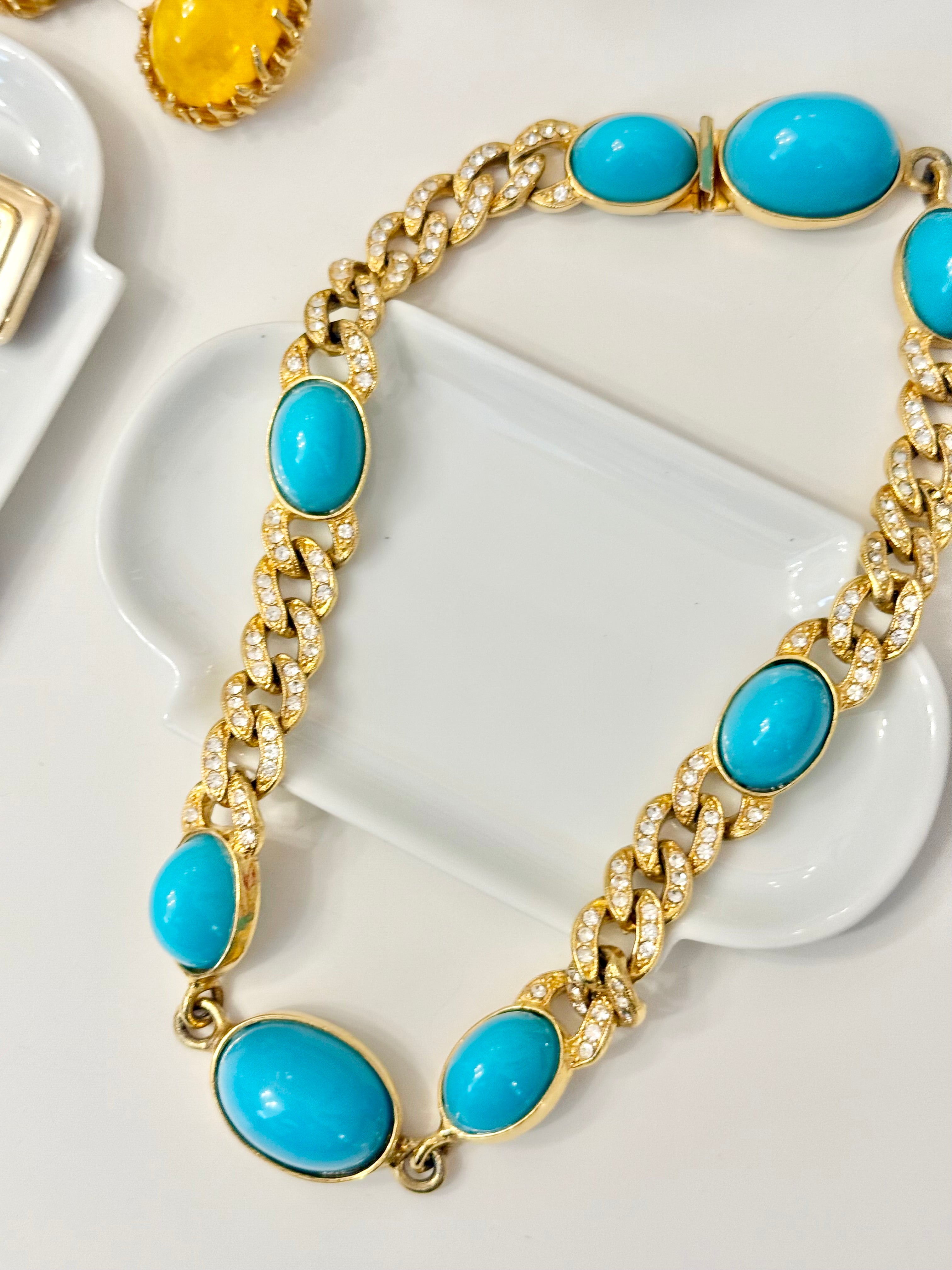The socialite and her love of a classy gold and turquoise link necklace..