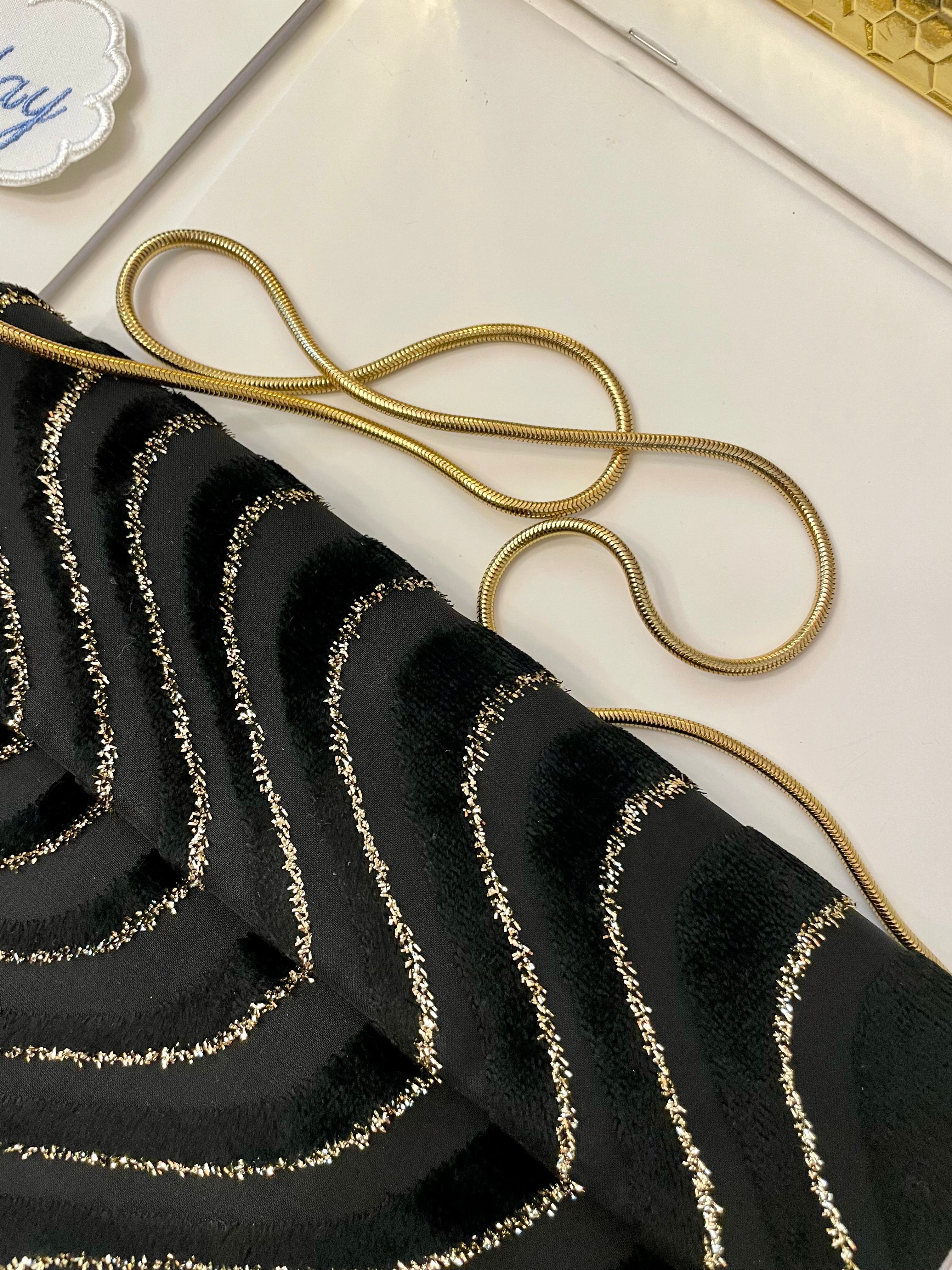 1970's dinner party noir and gold lame clutch bag.... so sassy