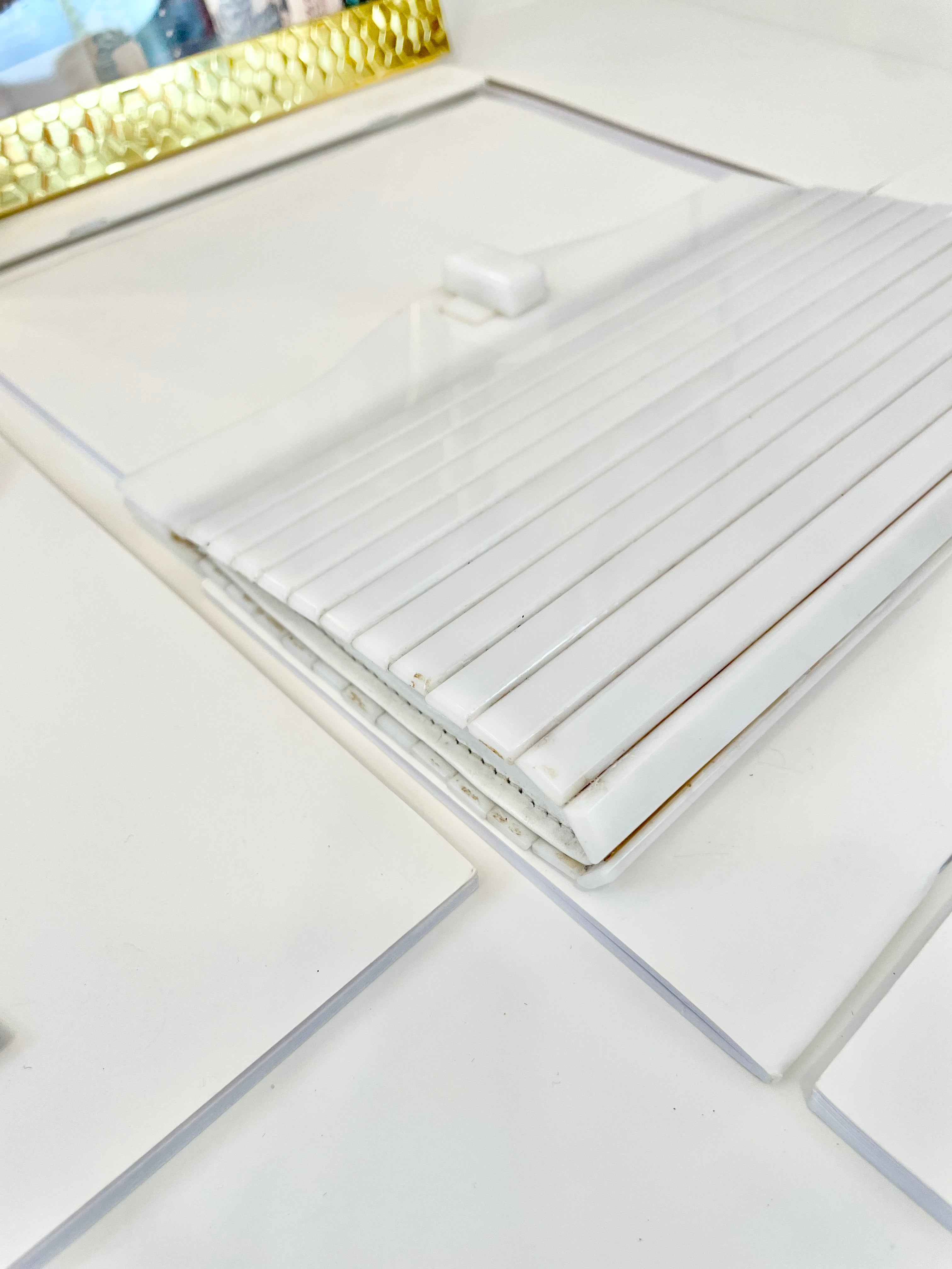 The most divine blanc plastic mod style clutch bag.... so feminine!