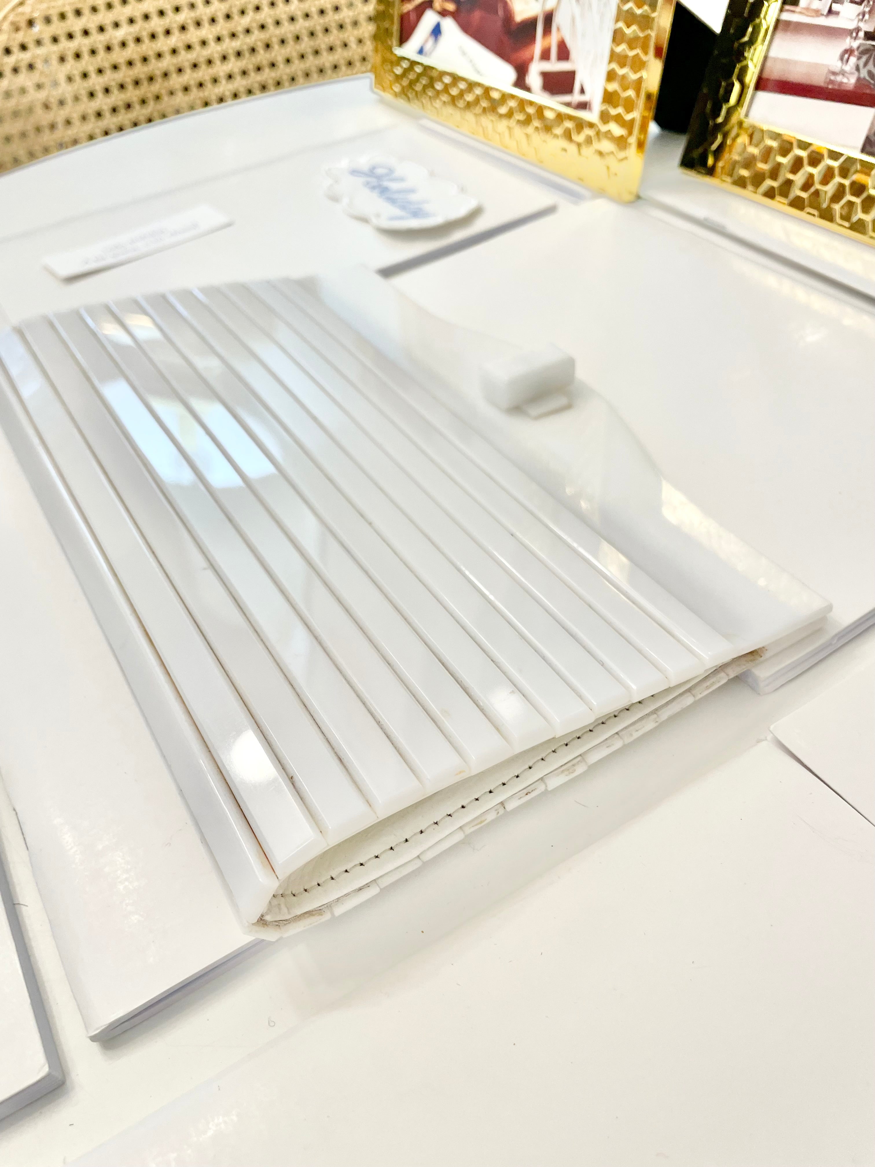 The most divine blanc plastic mod style clutch bag.... so feminine!