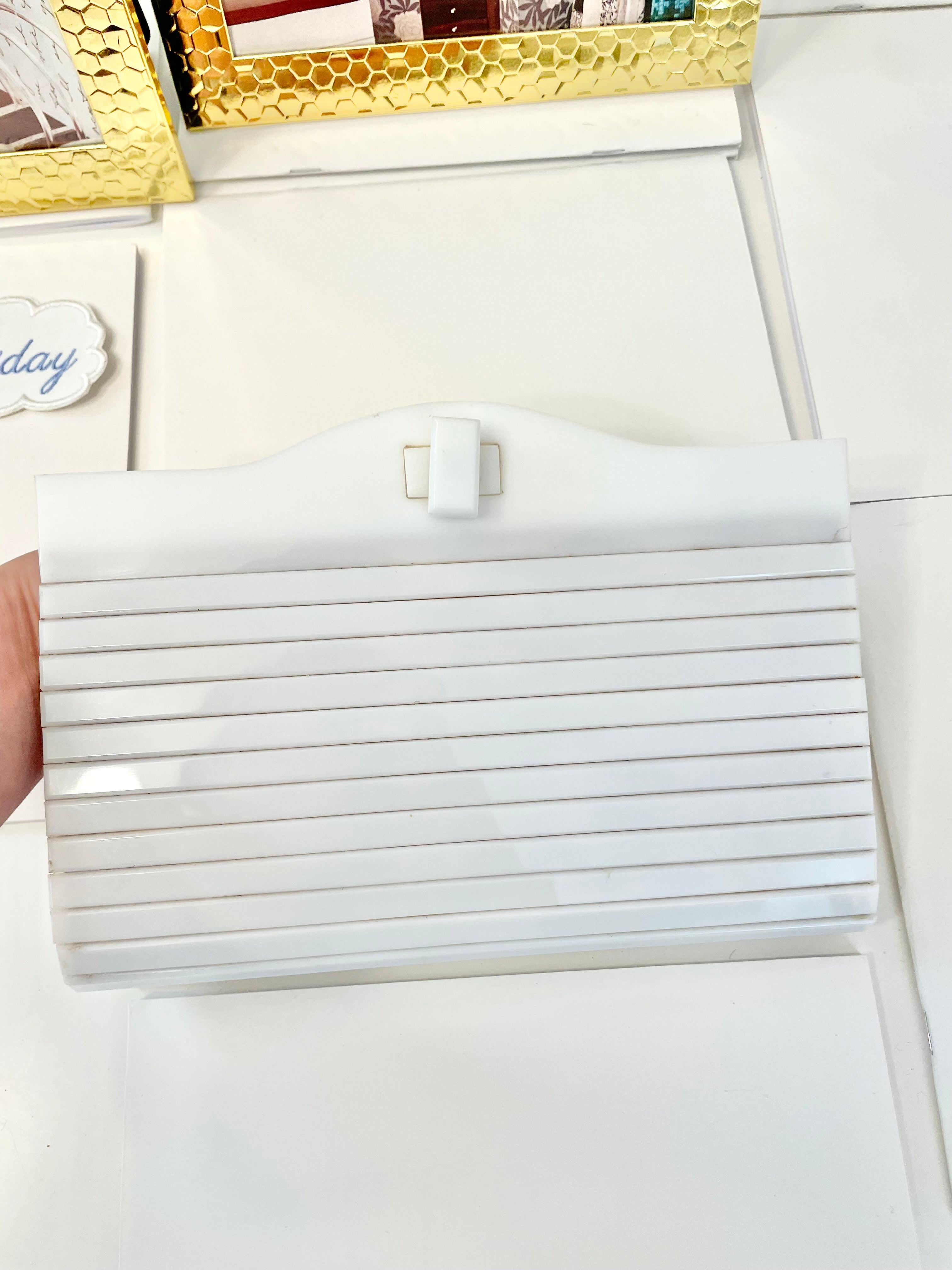 The most divine blanc plastic mod style clutch bag.... so feminine!