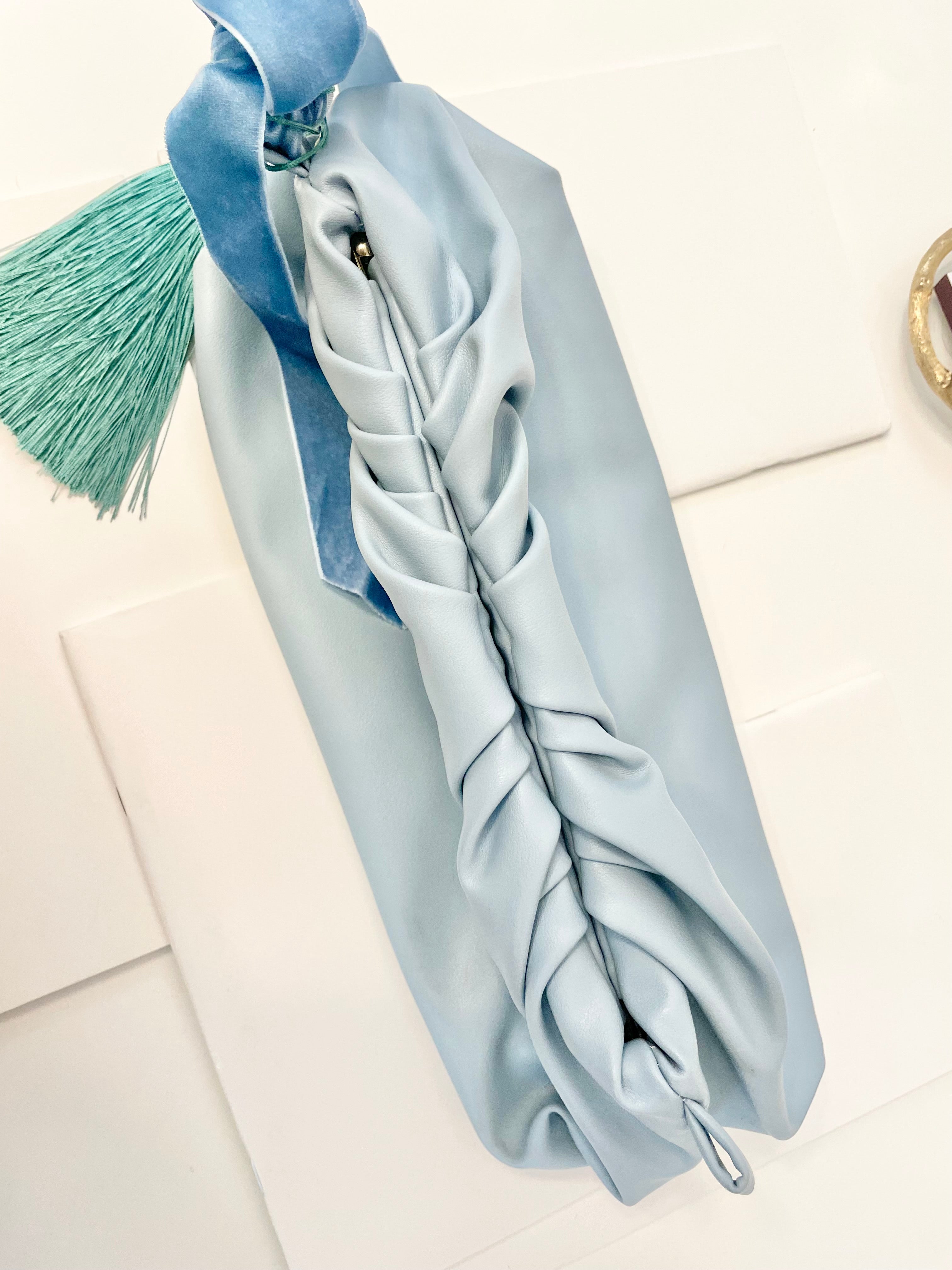 The most feminine soft blue tassel clutch bag... so lovely