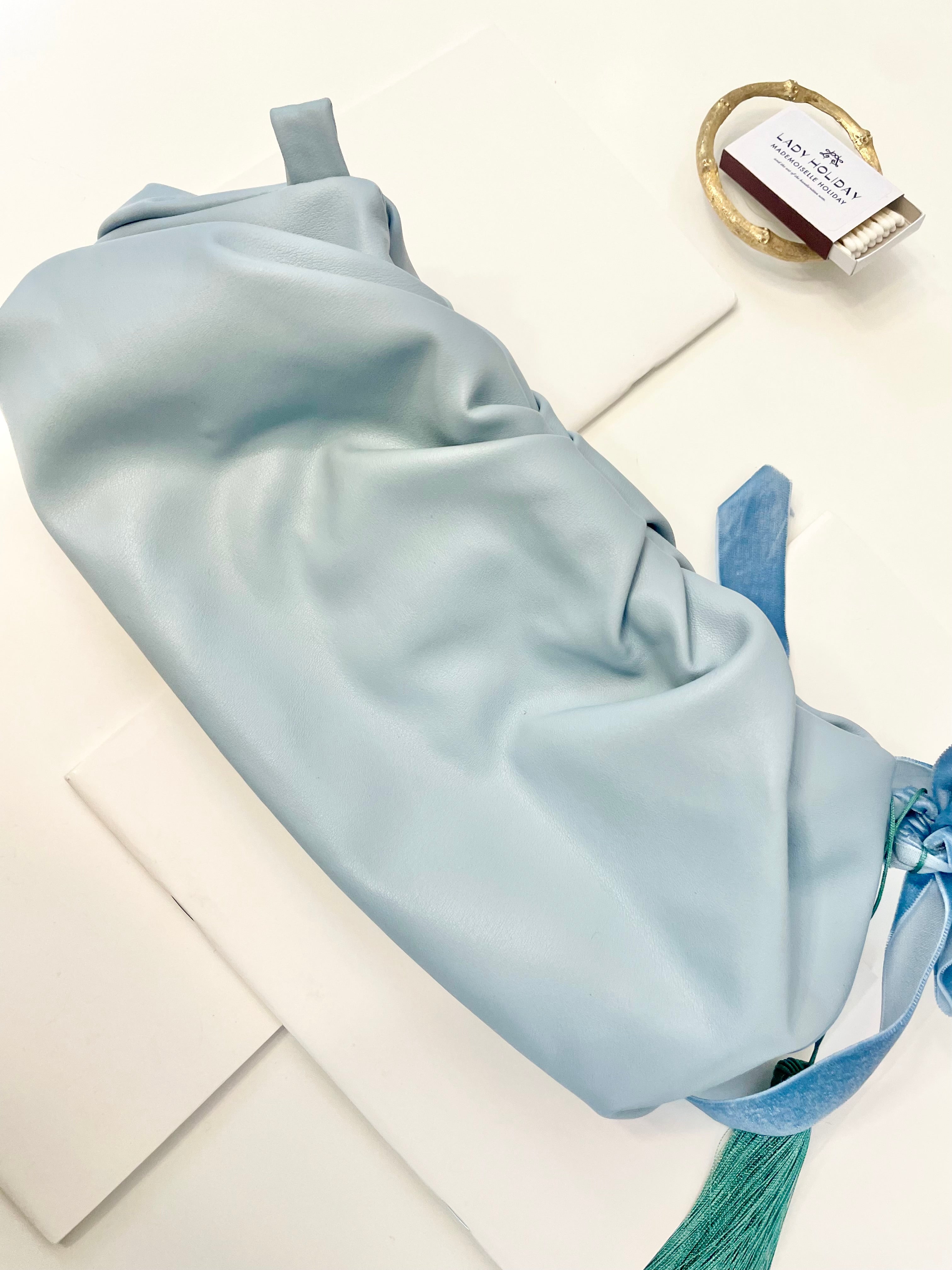 The most feminine soft blue tassel clutch bag... so lovely