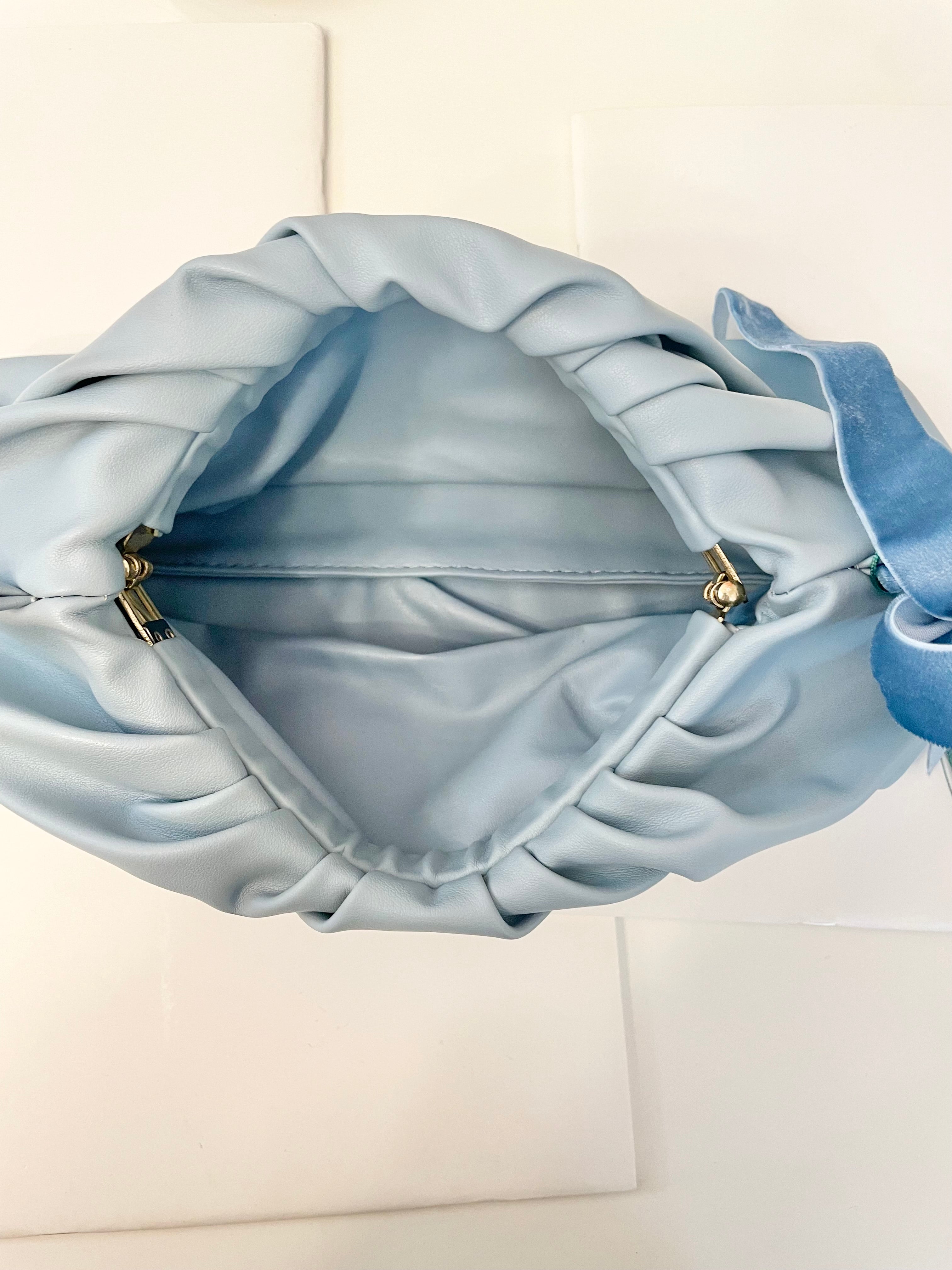The most feminine soft blue tassel clutch bag... so lovely