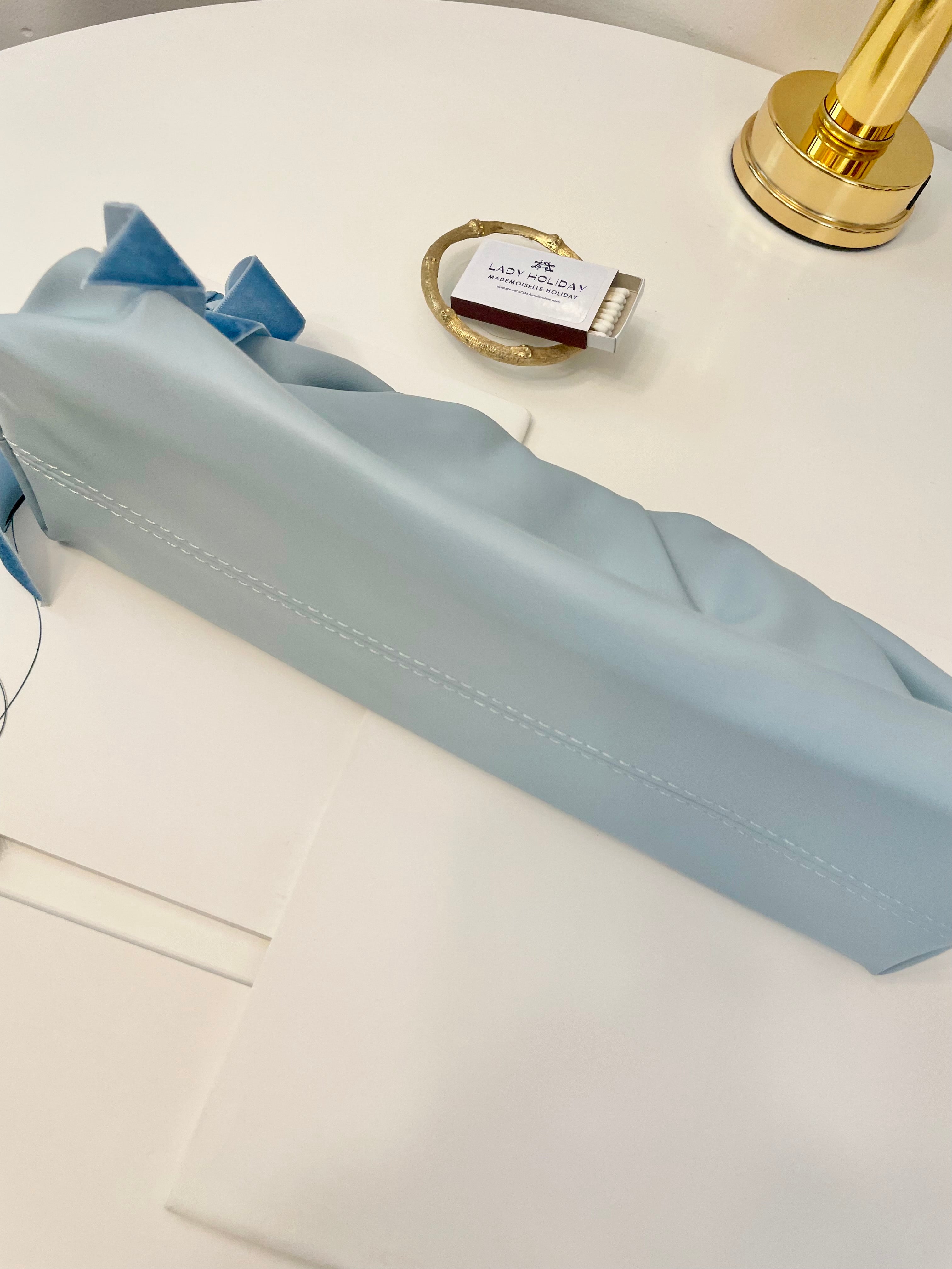 The most feminine soft blue tassel clutch bag... so lovely