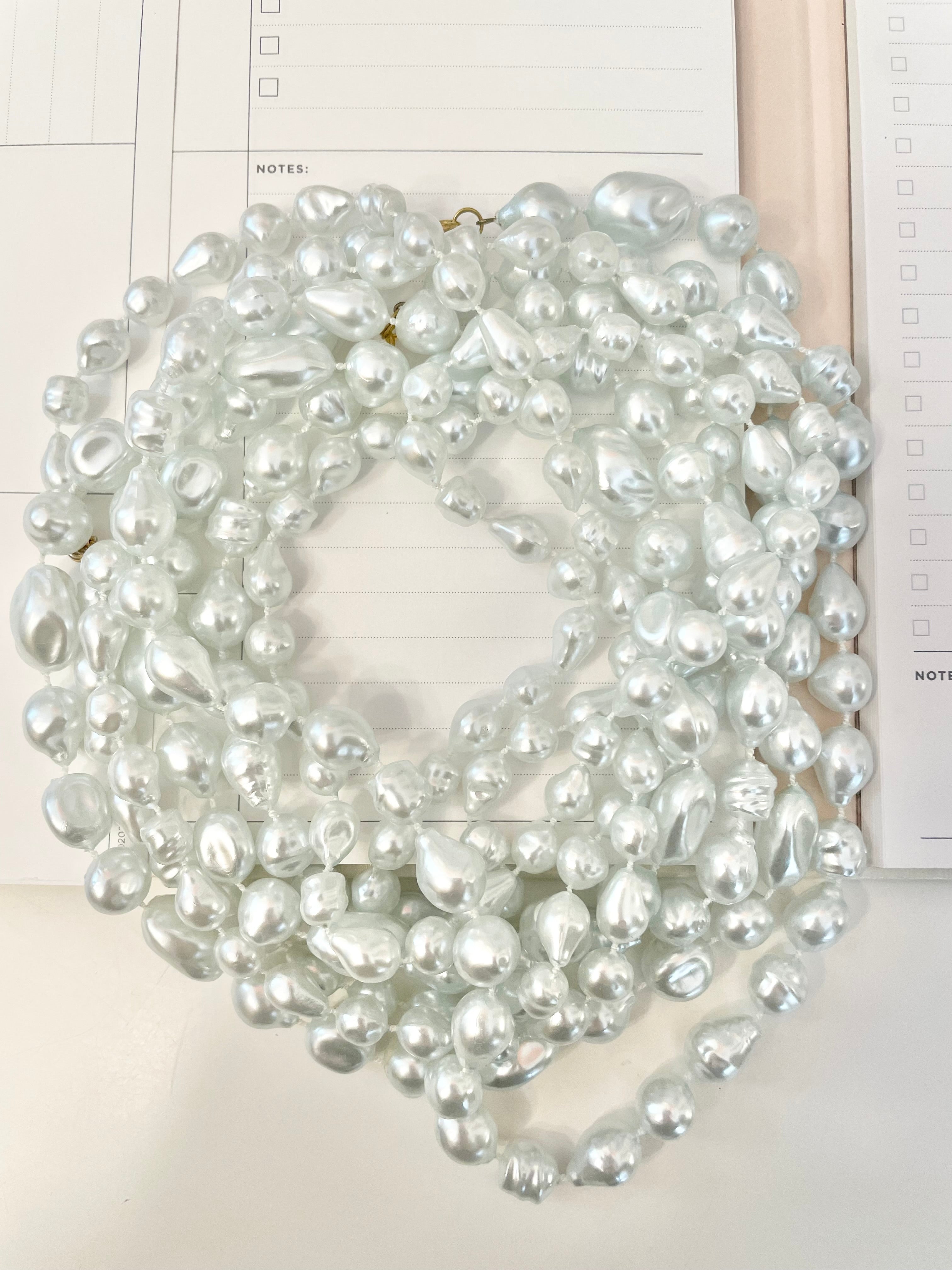 Charming multi strands of faux resin baroque pearl opera length necklaces... so lovely