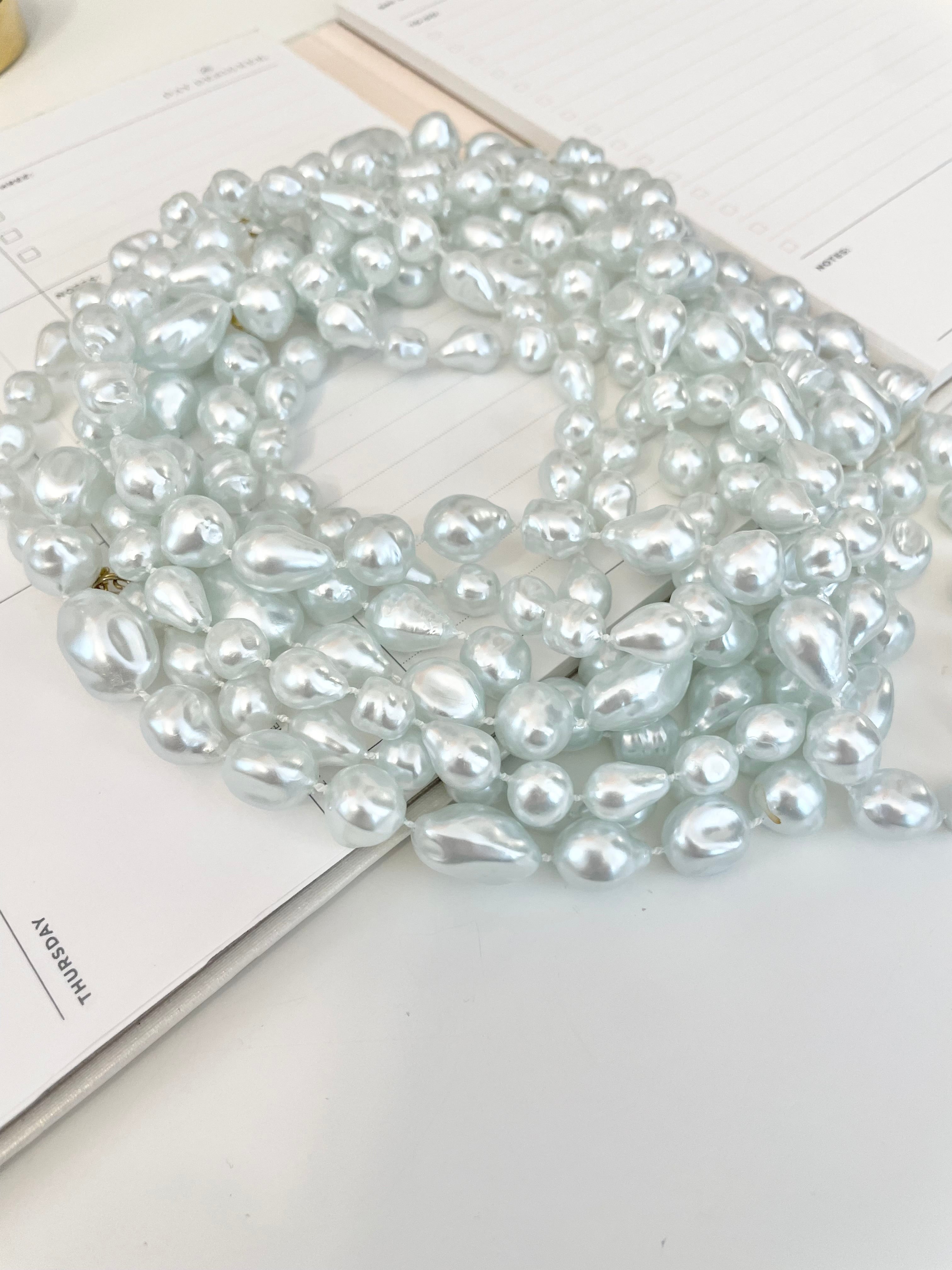 Charming multi strands of faux resin baroque pearl opera length necklaces... so lovely
