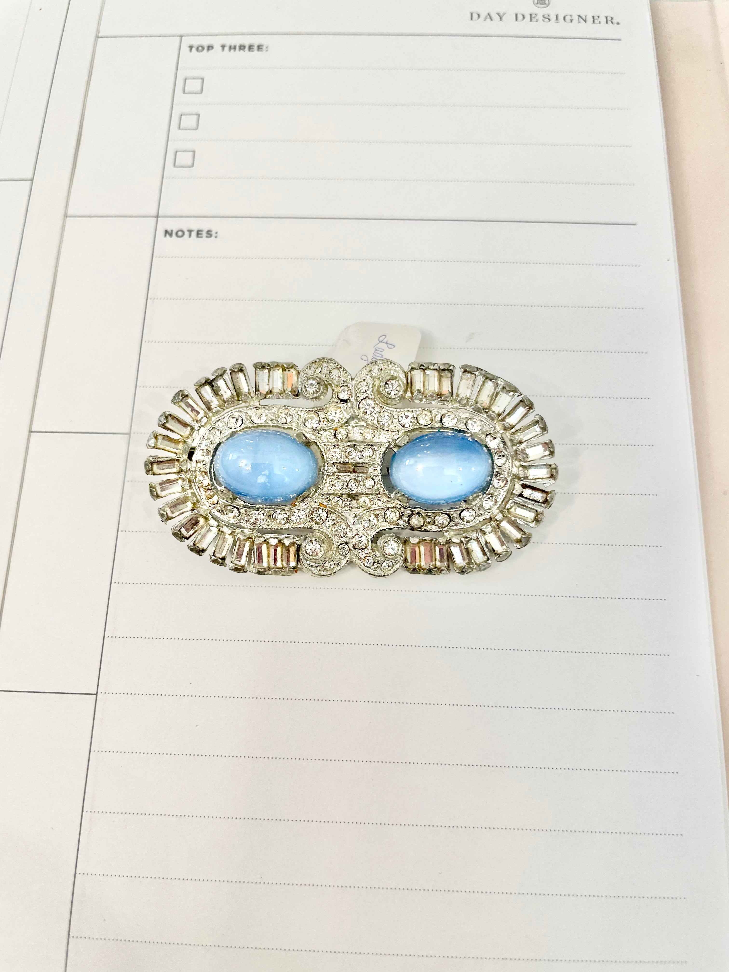 1940's stunning deco style brooch... I adore the blue moon glow glass stones.