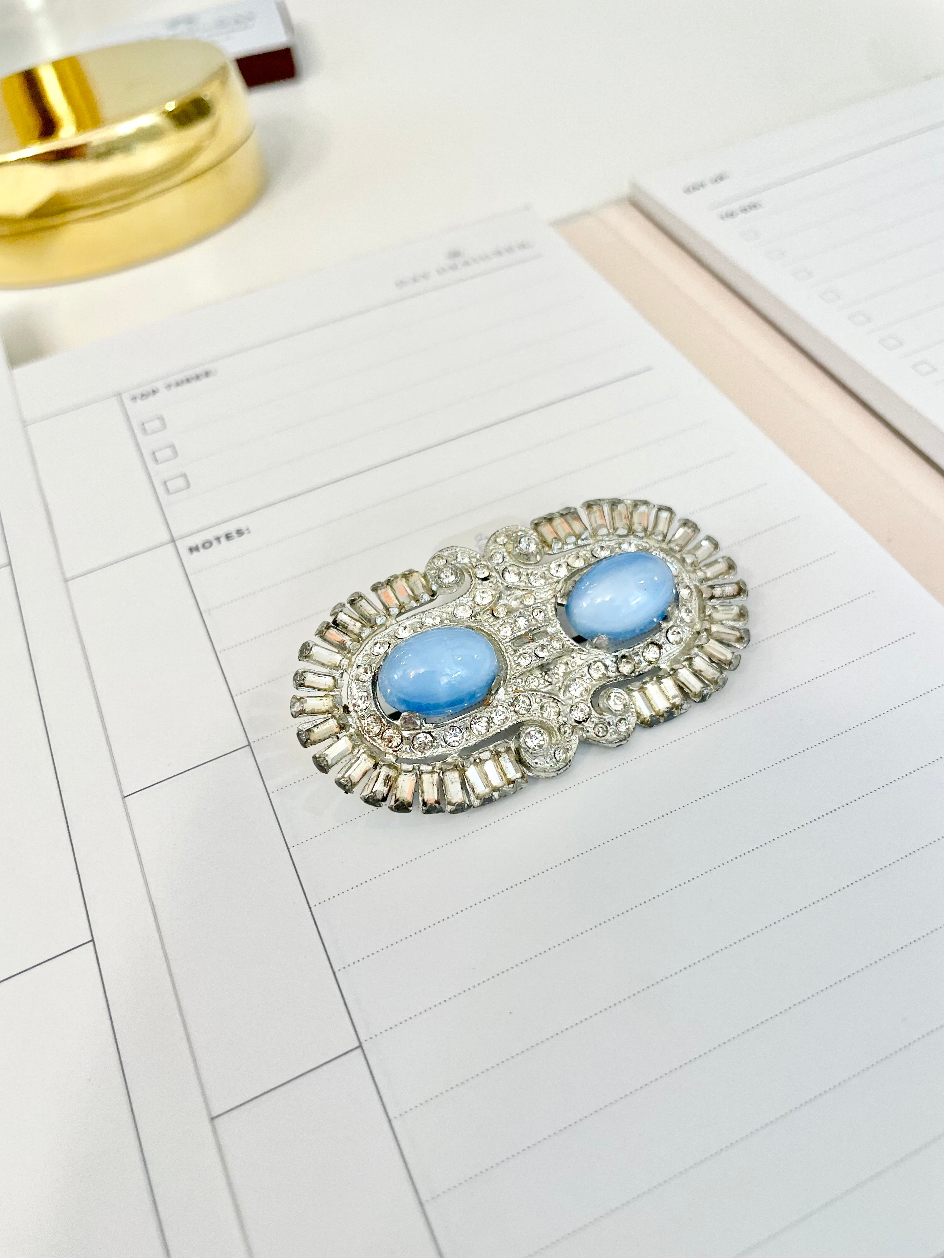 1940's stunning deco style brooch... I adore the blue moon glow glass stones.