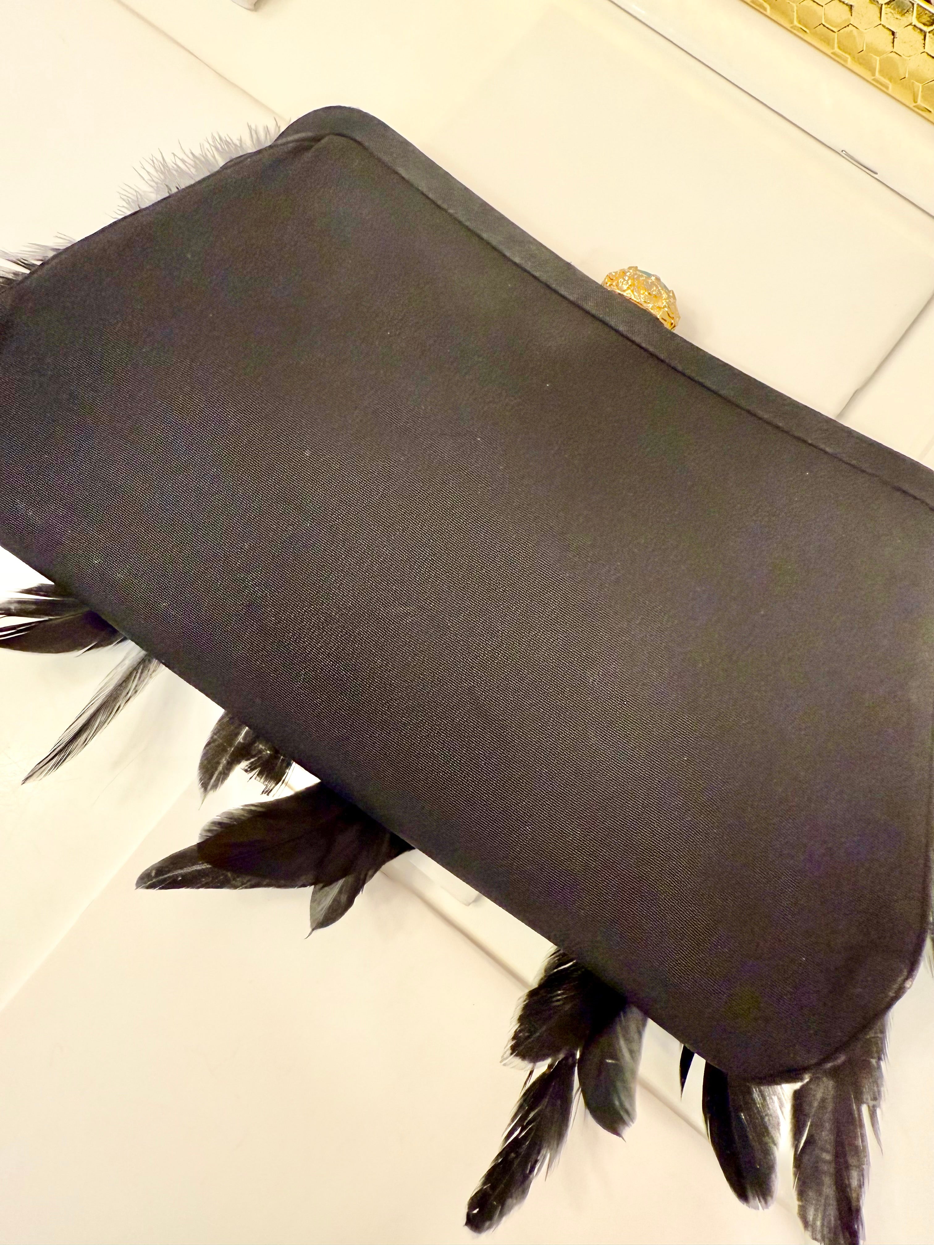 The most divine feather satin clutch... so divine