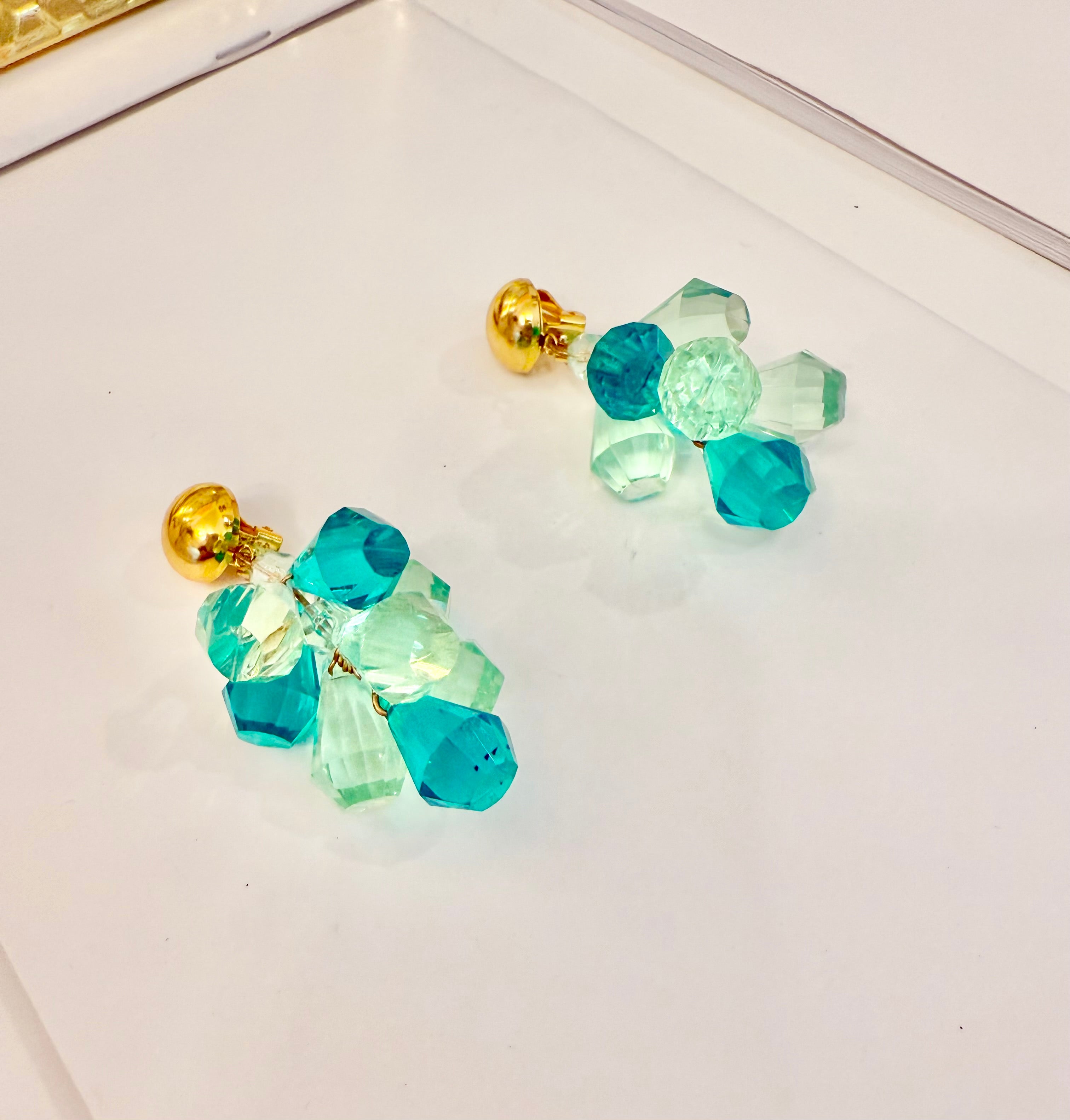 The most charming and colorful cascading monochromatic drop earrings... so elegant