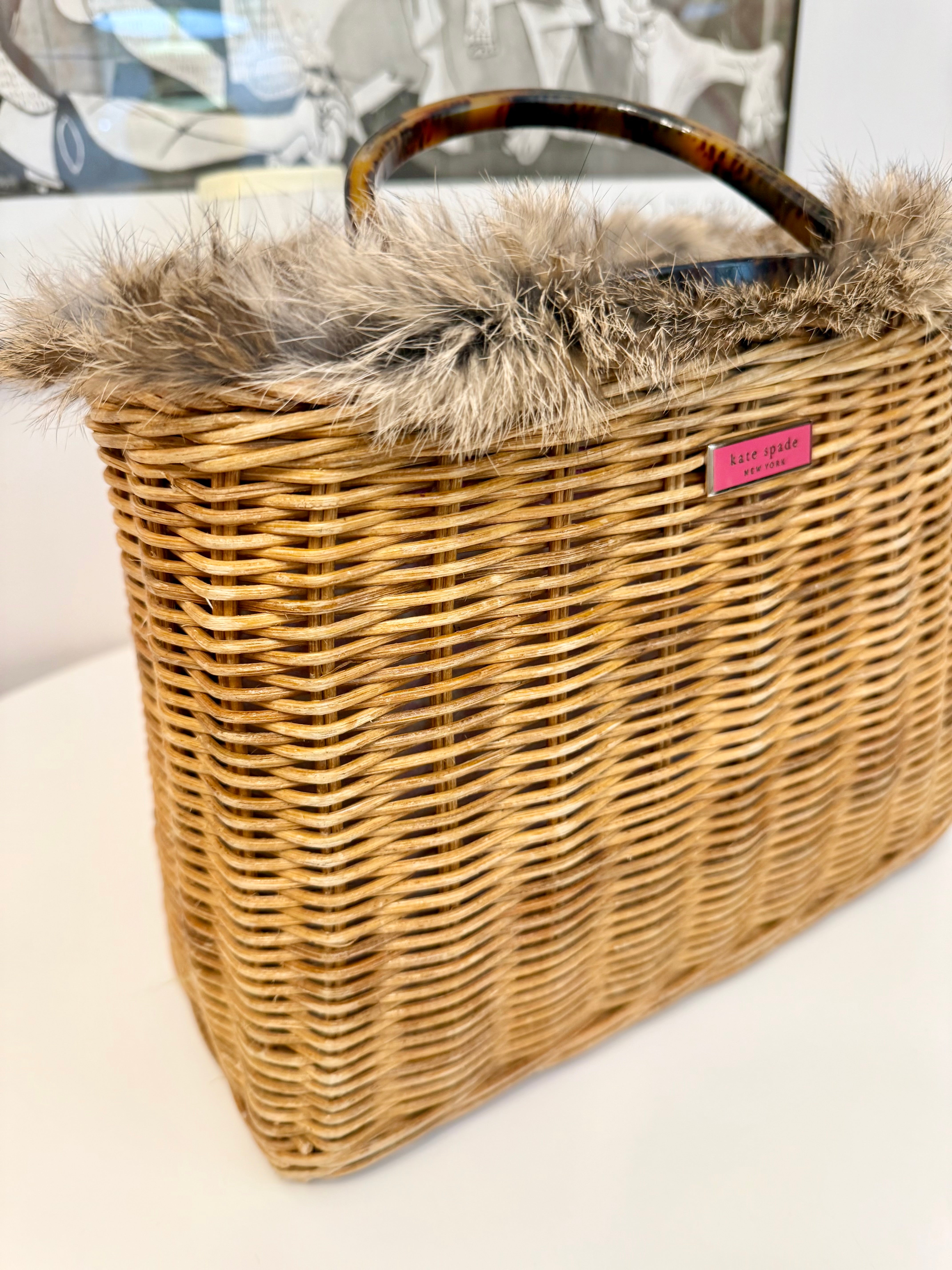 The most darling Kate Spade basket bag trimmed with fox fur....